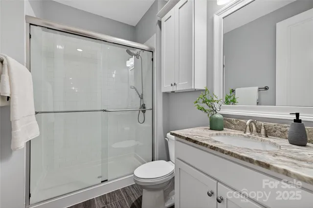 a bathroom with a bathtub sink and mirror