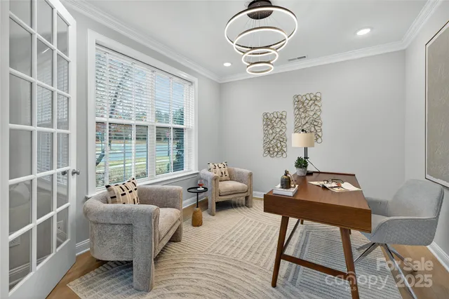 a living room with furniture kitchen view and a fireplace