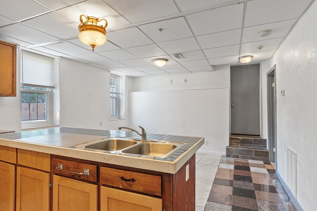 40 Aetna Street Worcester, MA 01604 - Photo 13 of 42 a kitchen that has a sink and a stove