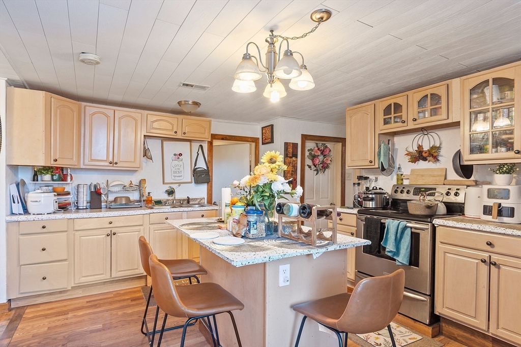 40 Aetna Street Worcester, MA 01604 - Photo 22 of 42 a kitchen with stainless steel appliances kitchen island granite countertop a sink and cabinets