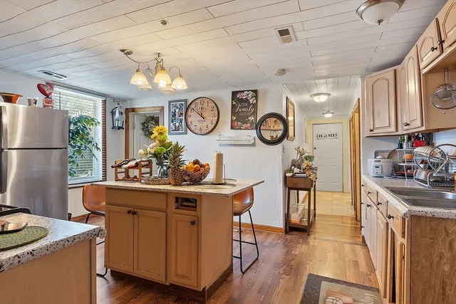 a kitchen with a sink and a stove top oven