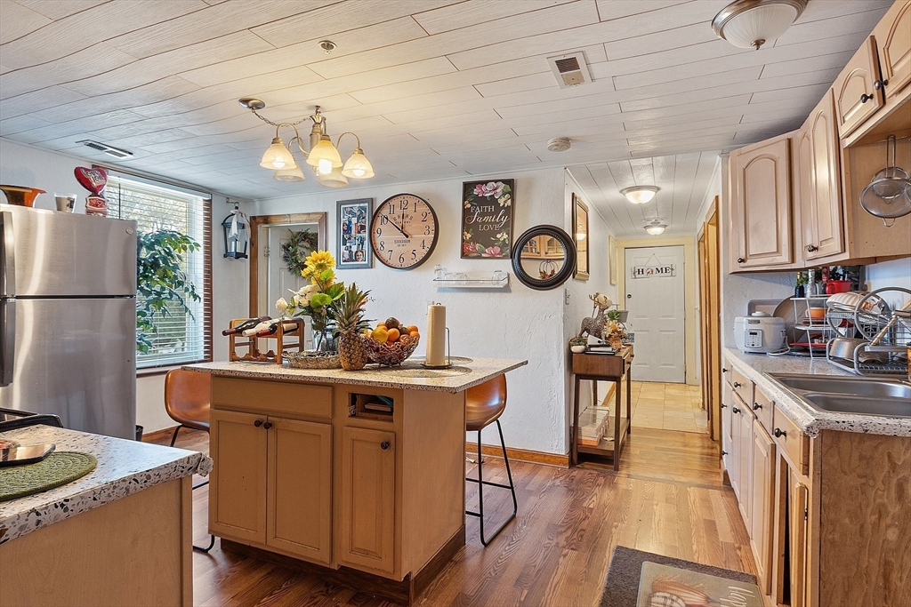 40 Aetna Street Worcester, MA 01604 - Photo 23 of 42 a kitchen with a sink and a stove top oven