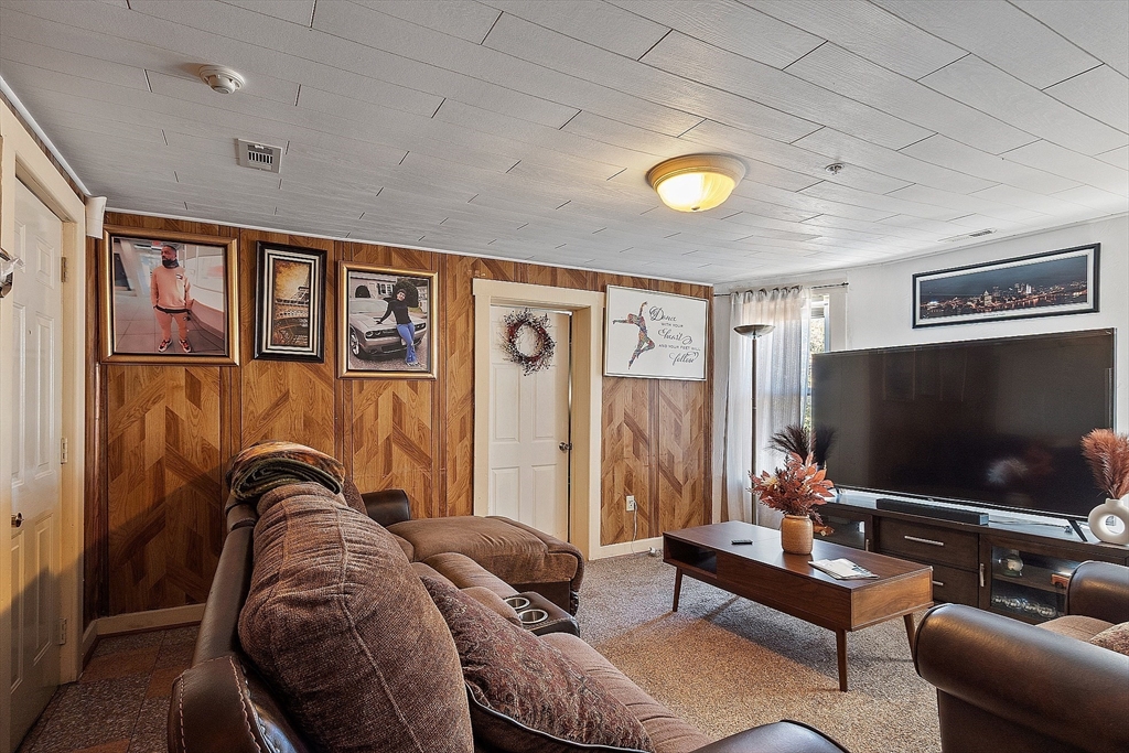 40 Aetna Street Worcester, MA 01604 - Photo 26 of 42 a living room with furniture and a flat screen tv