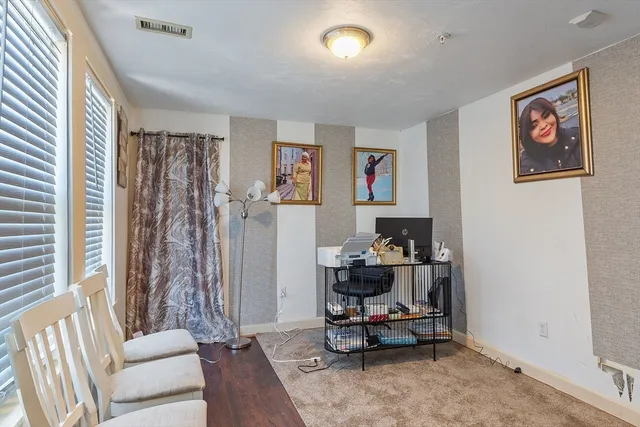 a living room with furniture and a rug
