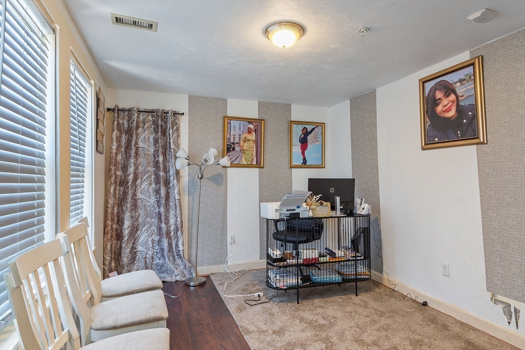 40 Aetna Street Worcester, MA 01604 - Photo 29 of 42 a living room with furniture and a rug