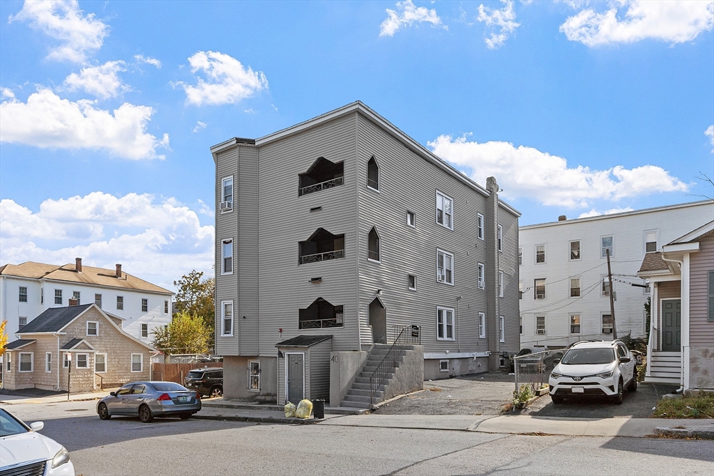 40 Aetna Street Worcester, MA 01604 - Photo 3 of 42 a car parked in front of a building