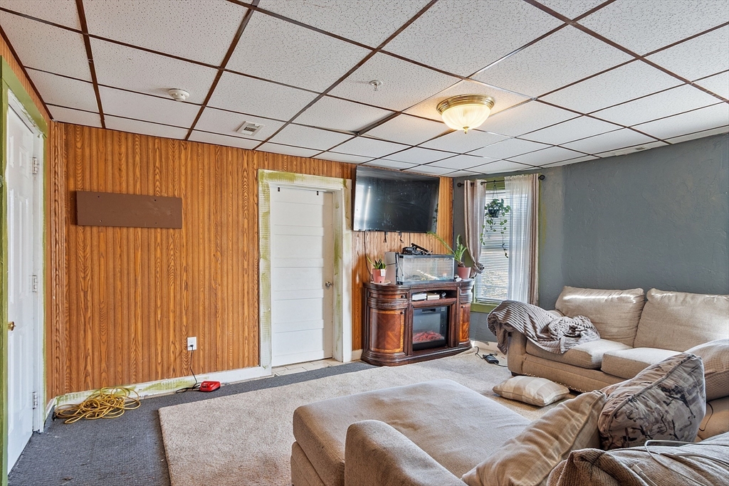 40 Aetna Street Worcester, MA 01604 - Photo 37 of 42 a bedroom with furniture and a chandelier