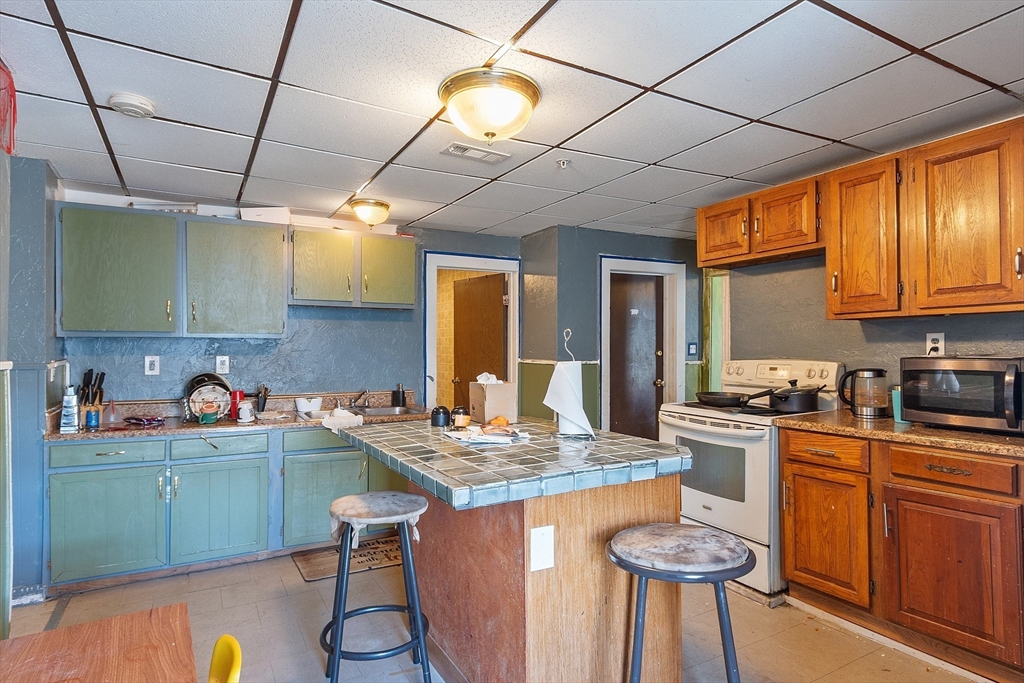 40 Aetna Street Worcester, MA 01604 - Photo 42 of 42 a kitchen with a sink cabinets and appliances
