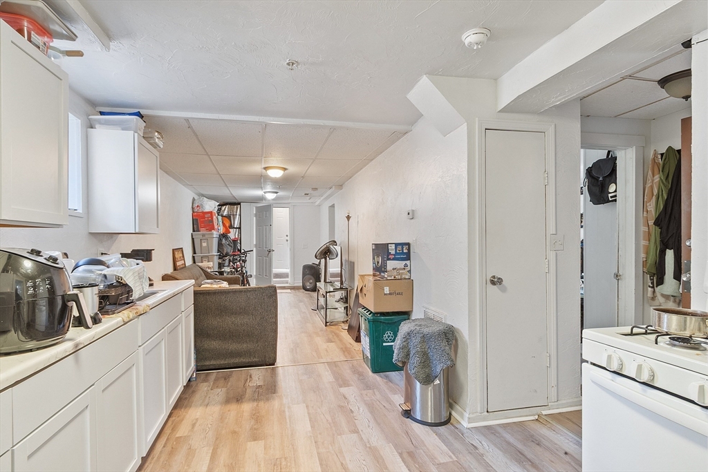 40 Aetna Street Worcester, MA 01604 - Photo 5 of 42 a kitchen with sink refrigerator and cabinets