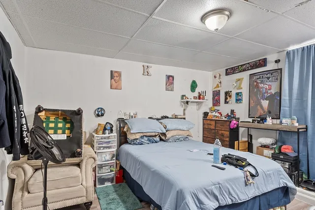 a bedroom that has a bed and a tv in it