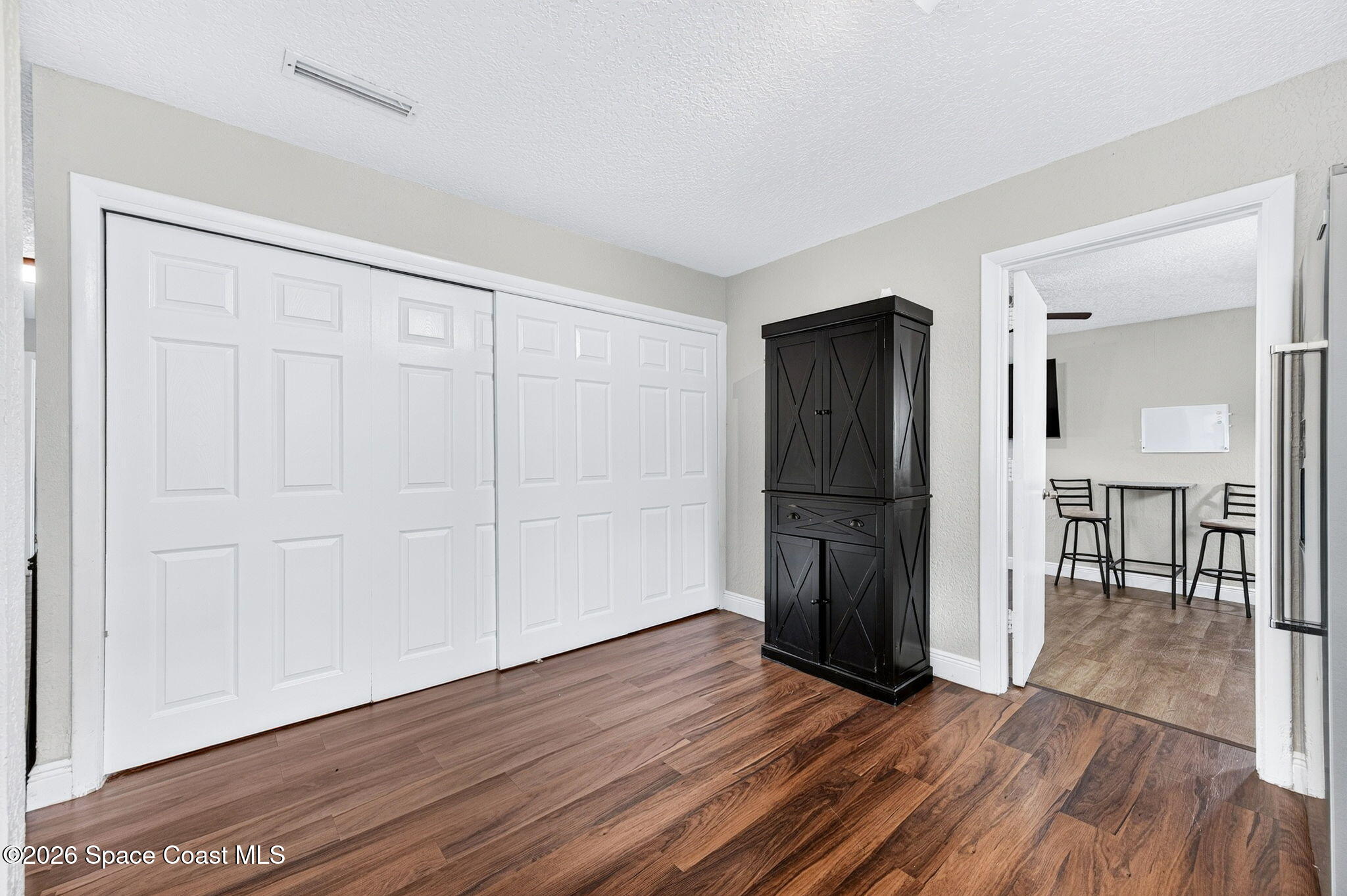 996 Botany Lane Rockledge, FL 32955 - Photo 16 of 35 a view of empty room with wooden floor