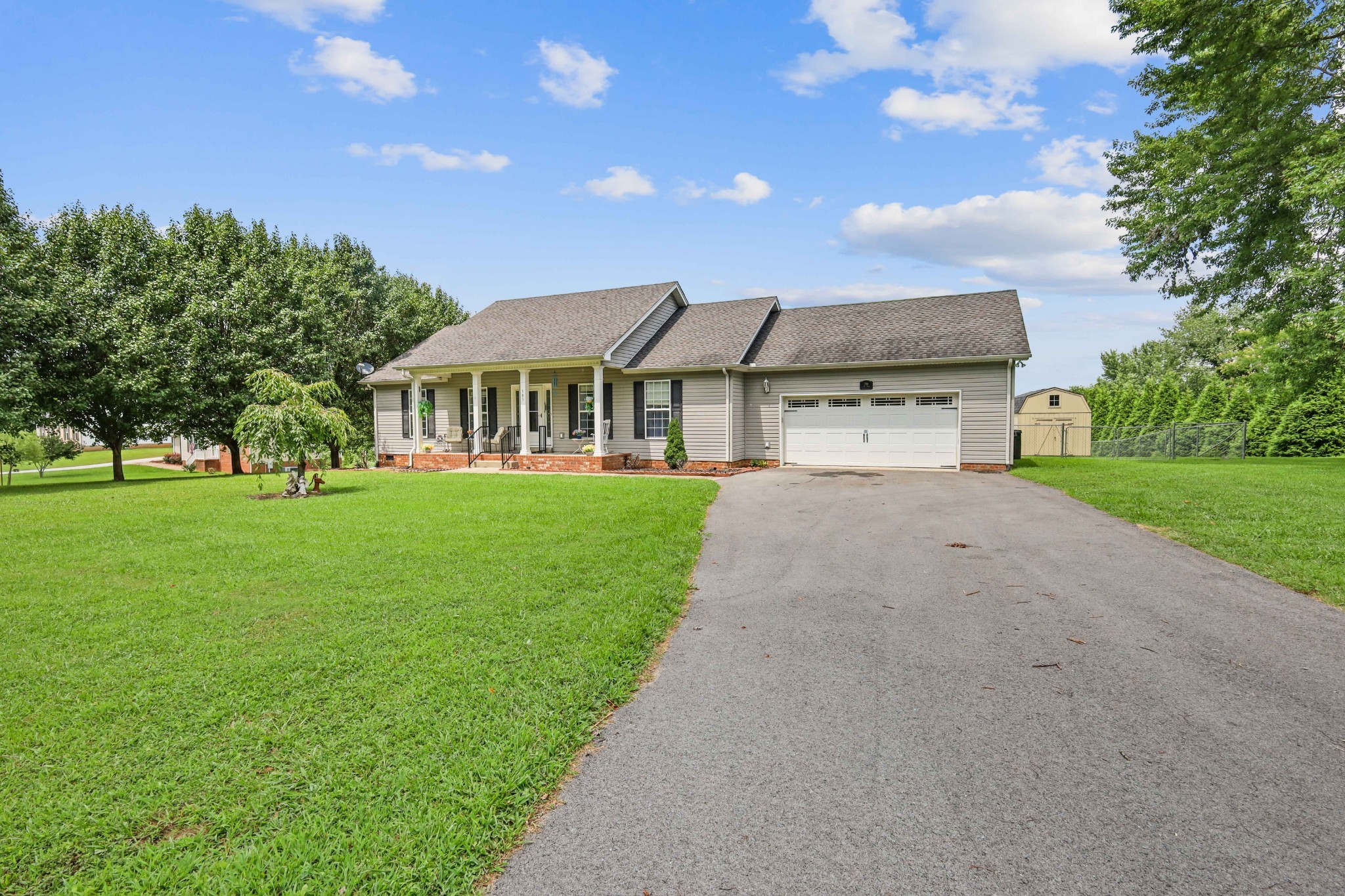 395 Lear Road Portland, TN 37148 - Photo 1 of 34 a front view of a house with a yard