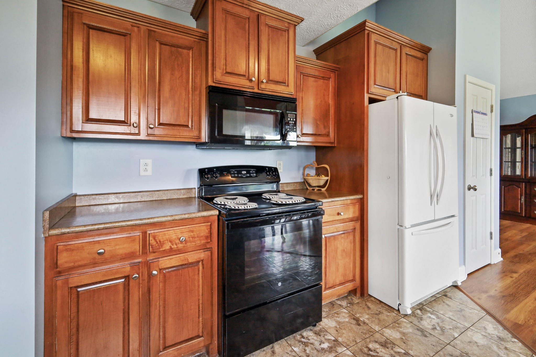 395 Lear Road Portland, TN 37148 - Photo 12 of 34 a kitchen with stainless steel appliances granite countertop a refrigerator stove and cabinets