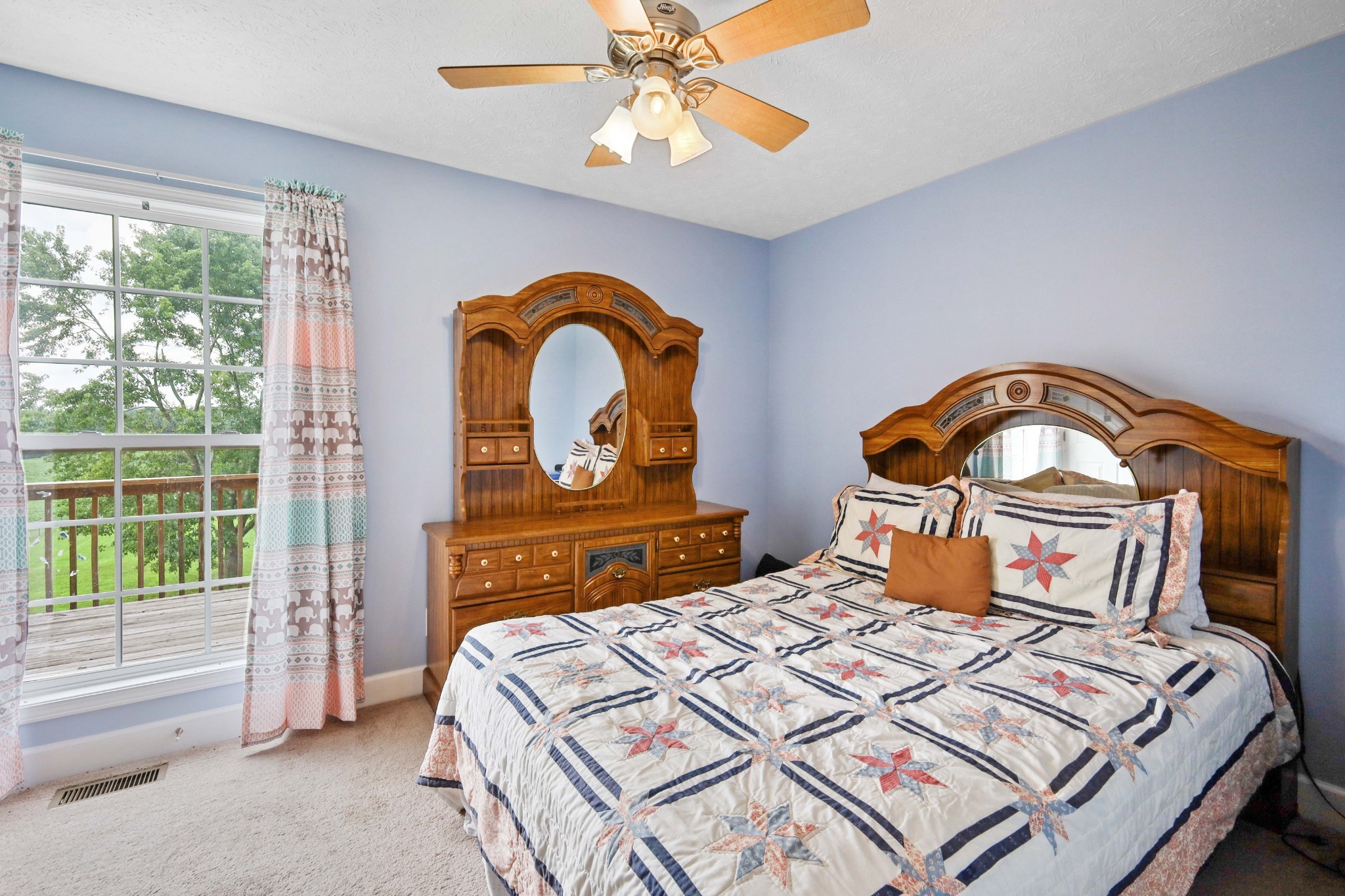 395 Lear Road Portland, TN 37148 - Photo 18 of 34 a bedroom with a bed a dresser and a large window