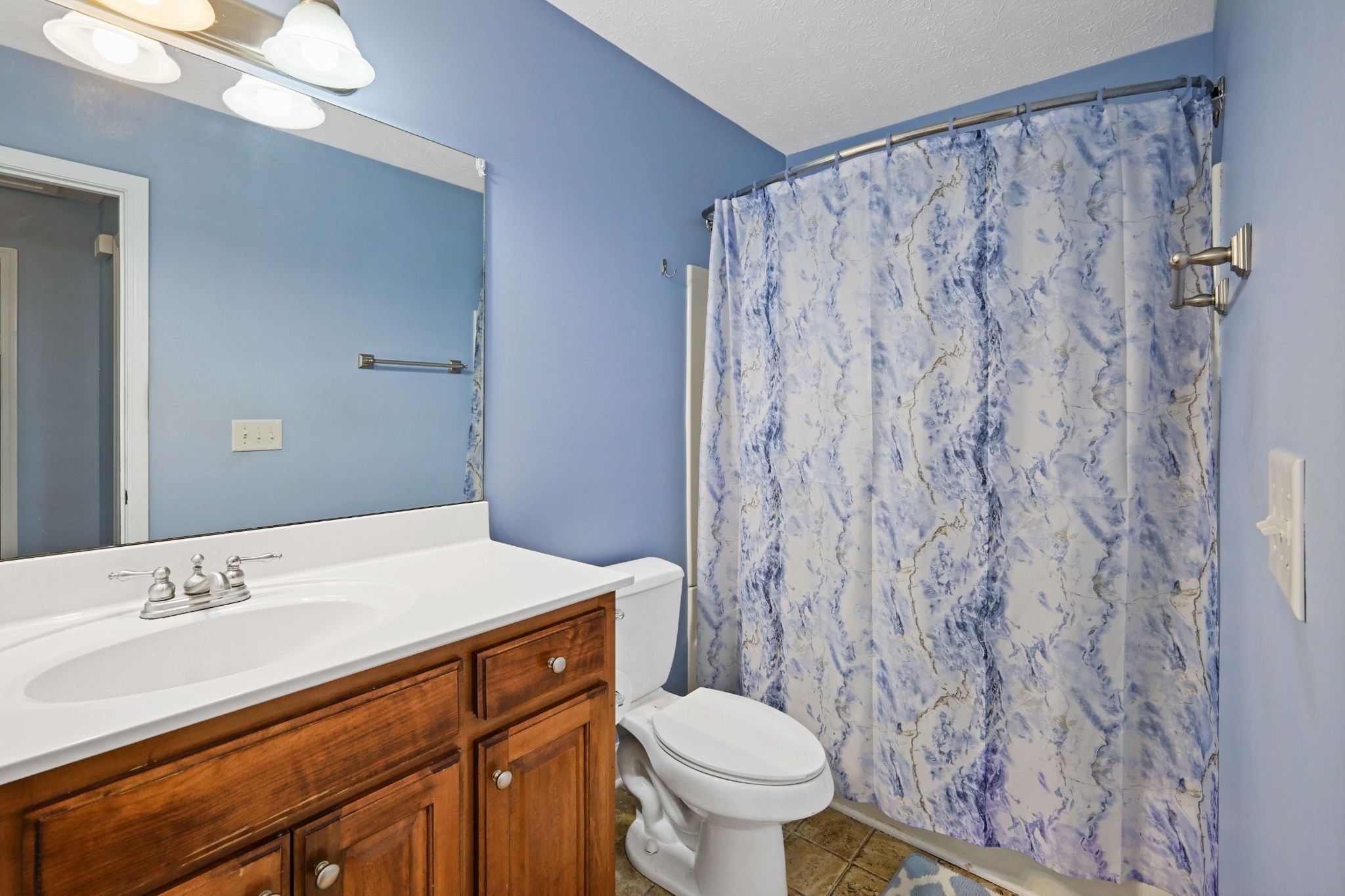 395 Lear Road Portland, TN 37148 - Photo 19 of 34 a bathroom with a sink toilet and shower