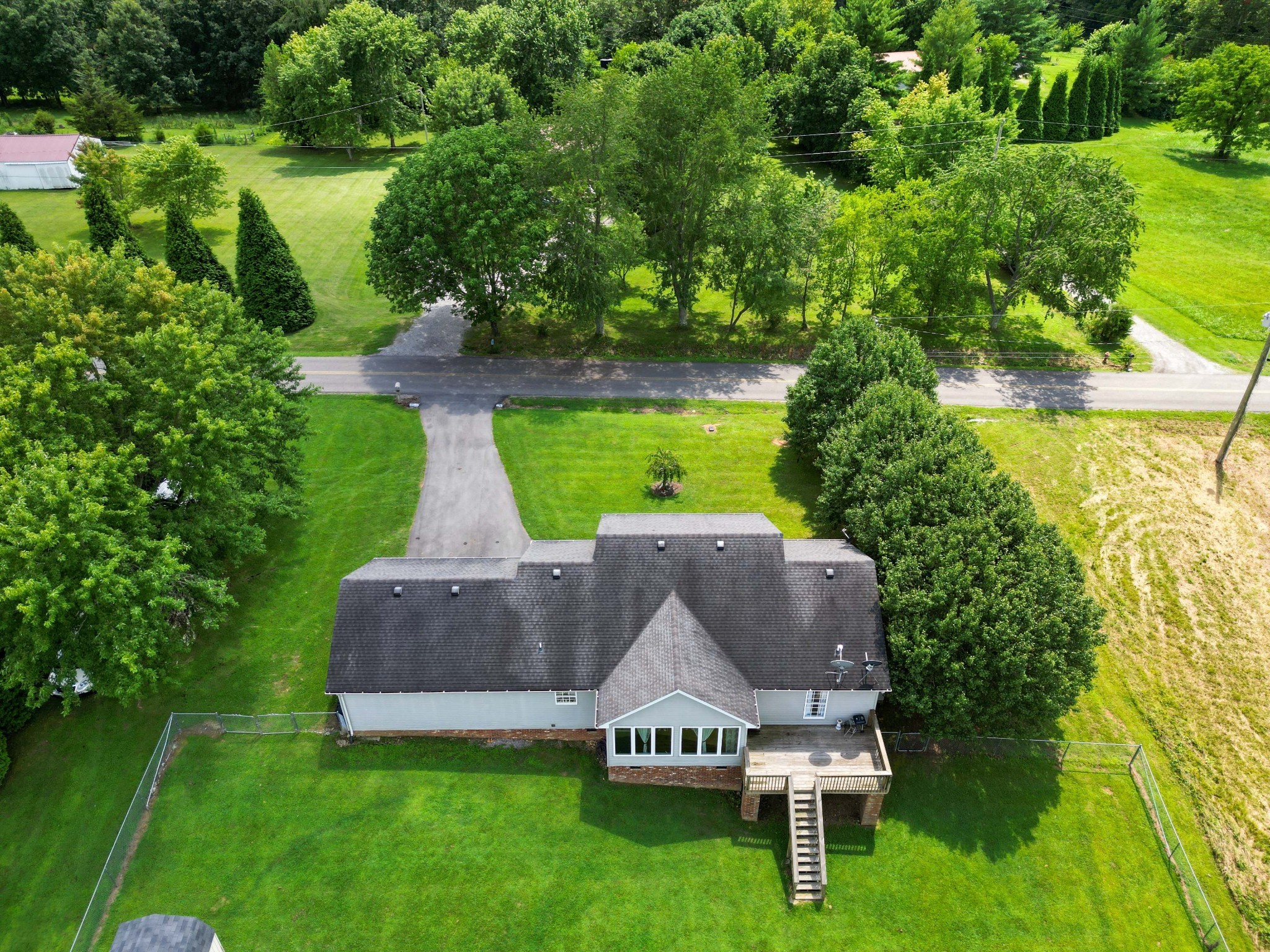 395 Lear Road Portland, TN 37148 - Photo 25 of 34 an aerial view of a house with swimming pool and garden