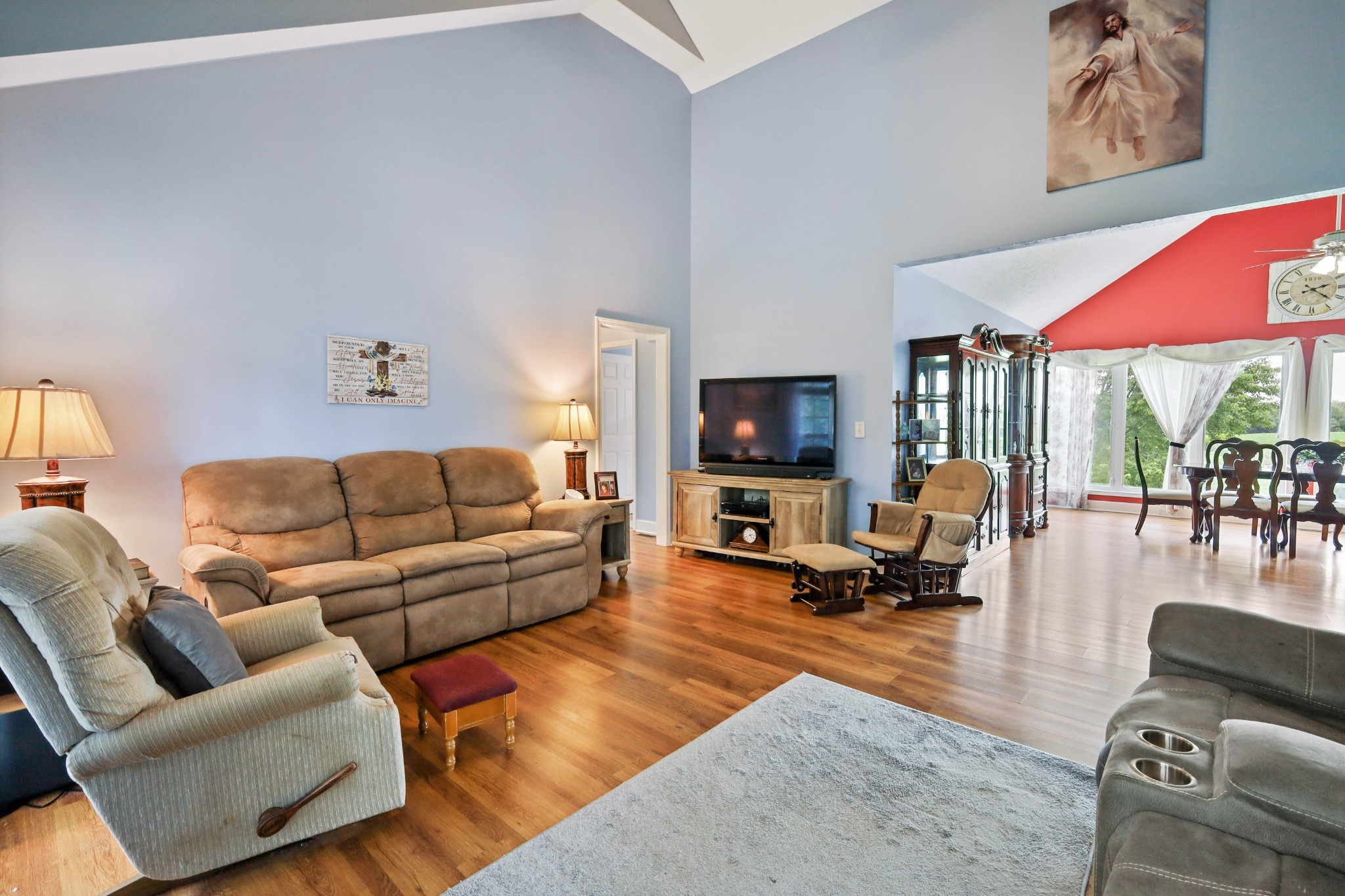 395 Lear Road Portland, TN 37148 - Photo 9 of 34 a living room with furniture a rug and a flat screen tv