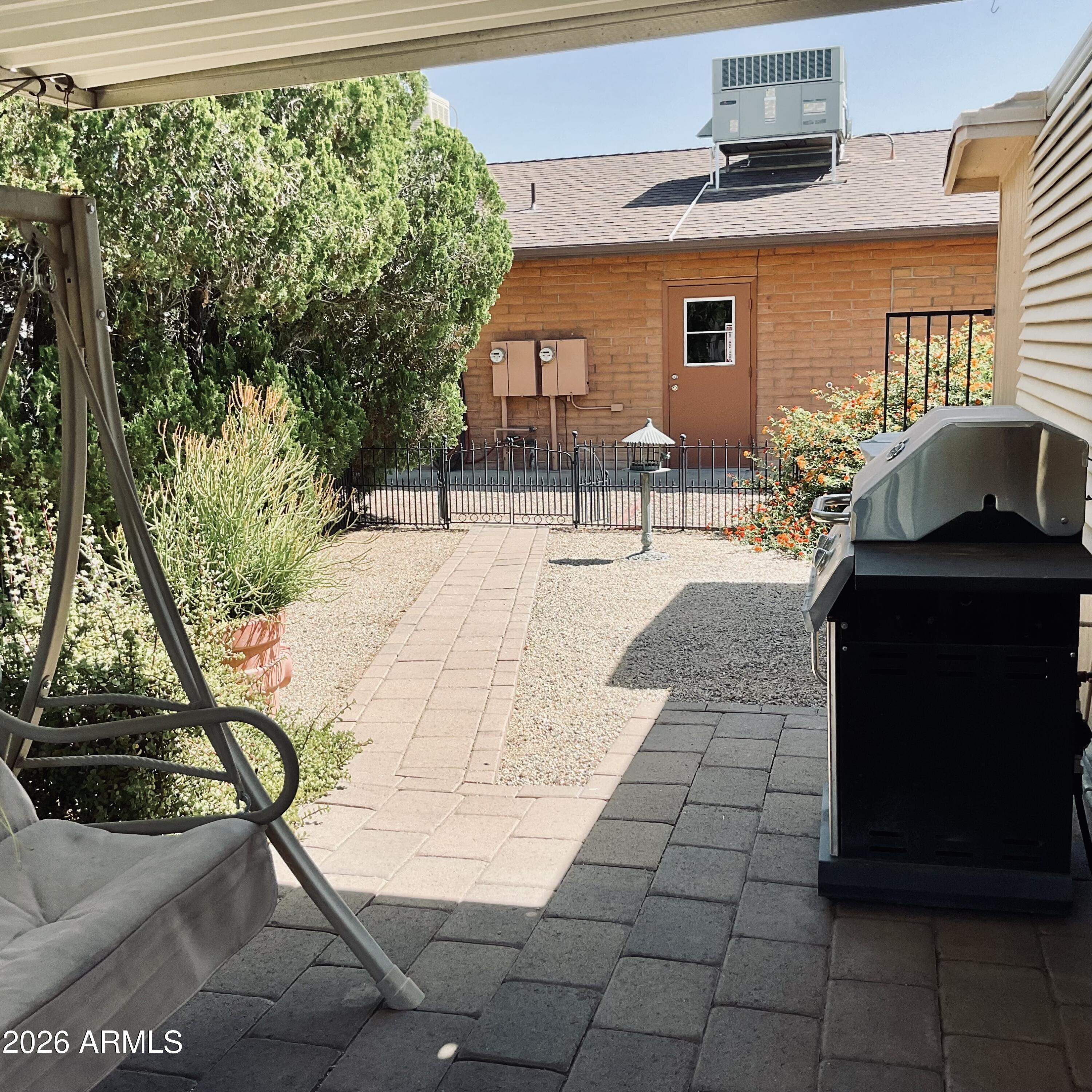 3036 East Utopia Road, Unit 52 Phoenix, AZ 85050 - Photo 26 of 36 Side Yard to Rear Gate