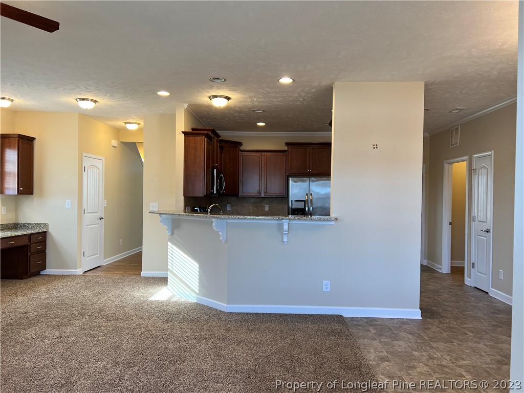 4775 McKinnon Farm Road Fayetteville, NC 28304 - Photo 11 of 45 a view of kitchen with stainless steel appliances granite countertop a refrigerator and a sink