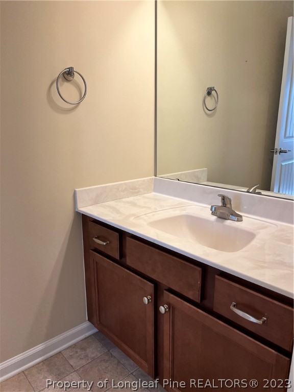 4775 McKinnon Farm Road Fayetteville, NC 28304 - Photo 33 of 45 a bathroom with a sink vanity and a mirror