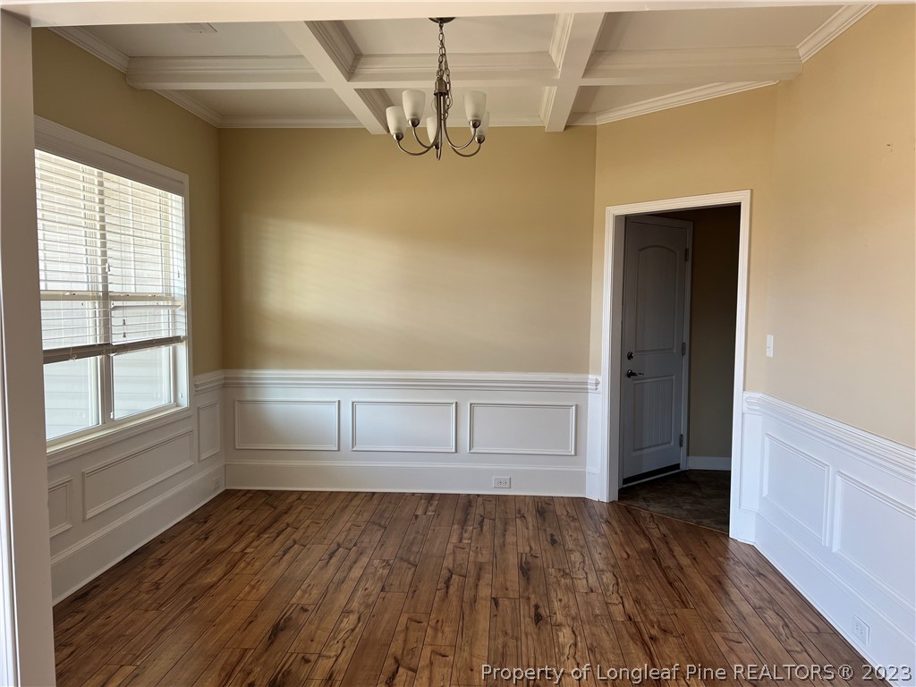 4775 McKinnon Farm Road Fayetteville, NC 28304 - Photo 5 of 45 an empty room with wooden floor and windows