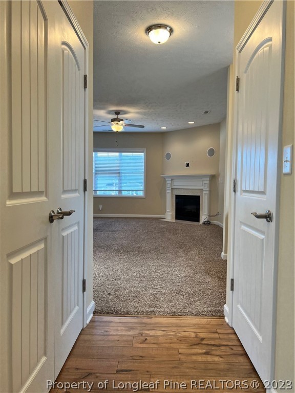 4775 McKinnon Farm Road Fayetteville, NC 28304 - Photo 8 of 45 an empty room with an entryway and fireplace
