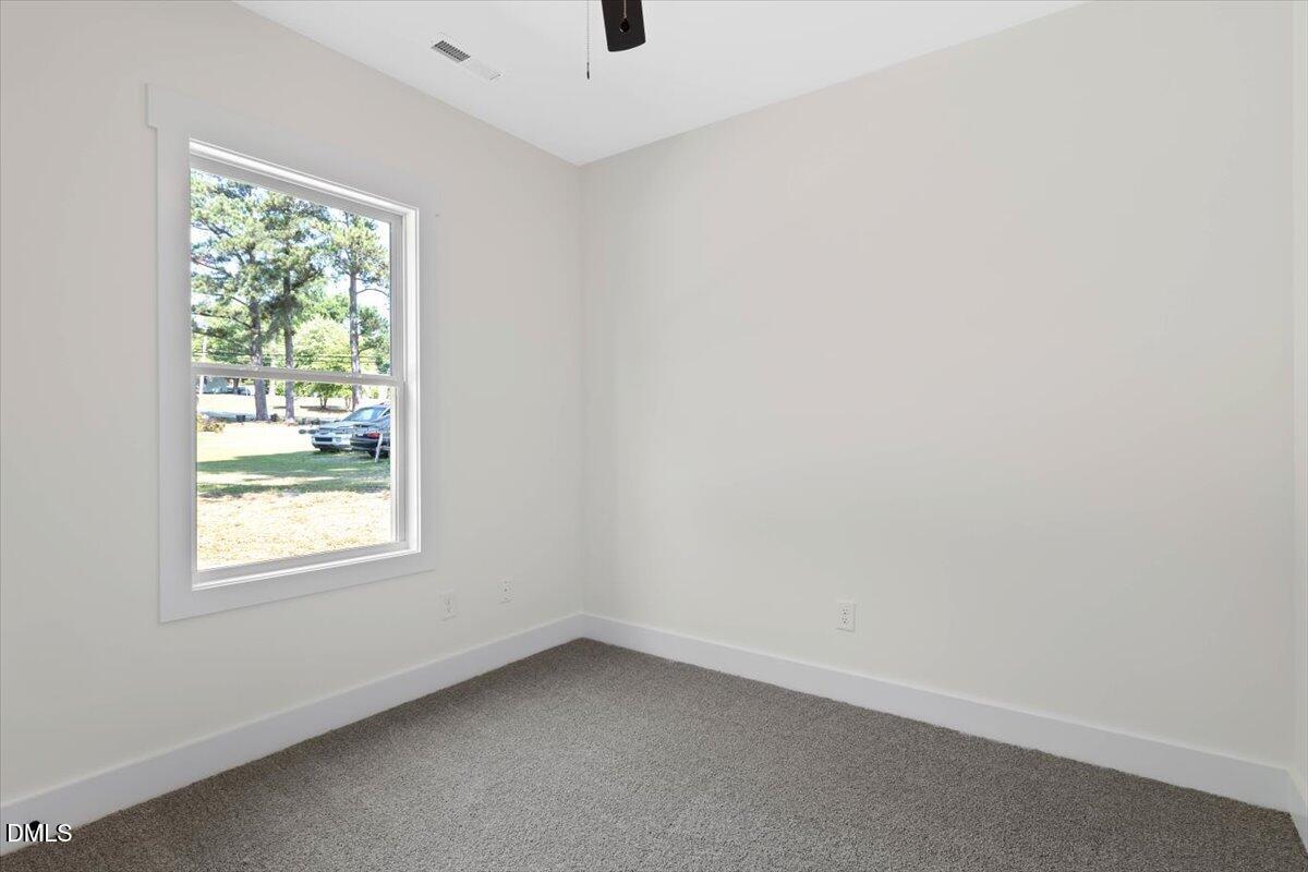 1655 Bunnlevel Erwin Road Bunnlevel, NC 28323 - Photo 23 of 26 an empty room with a window