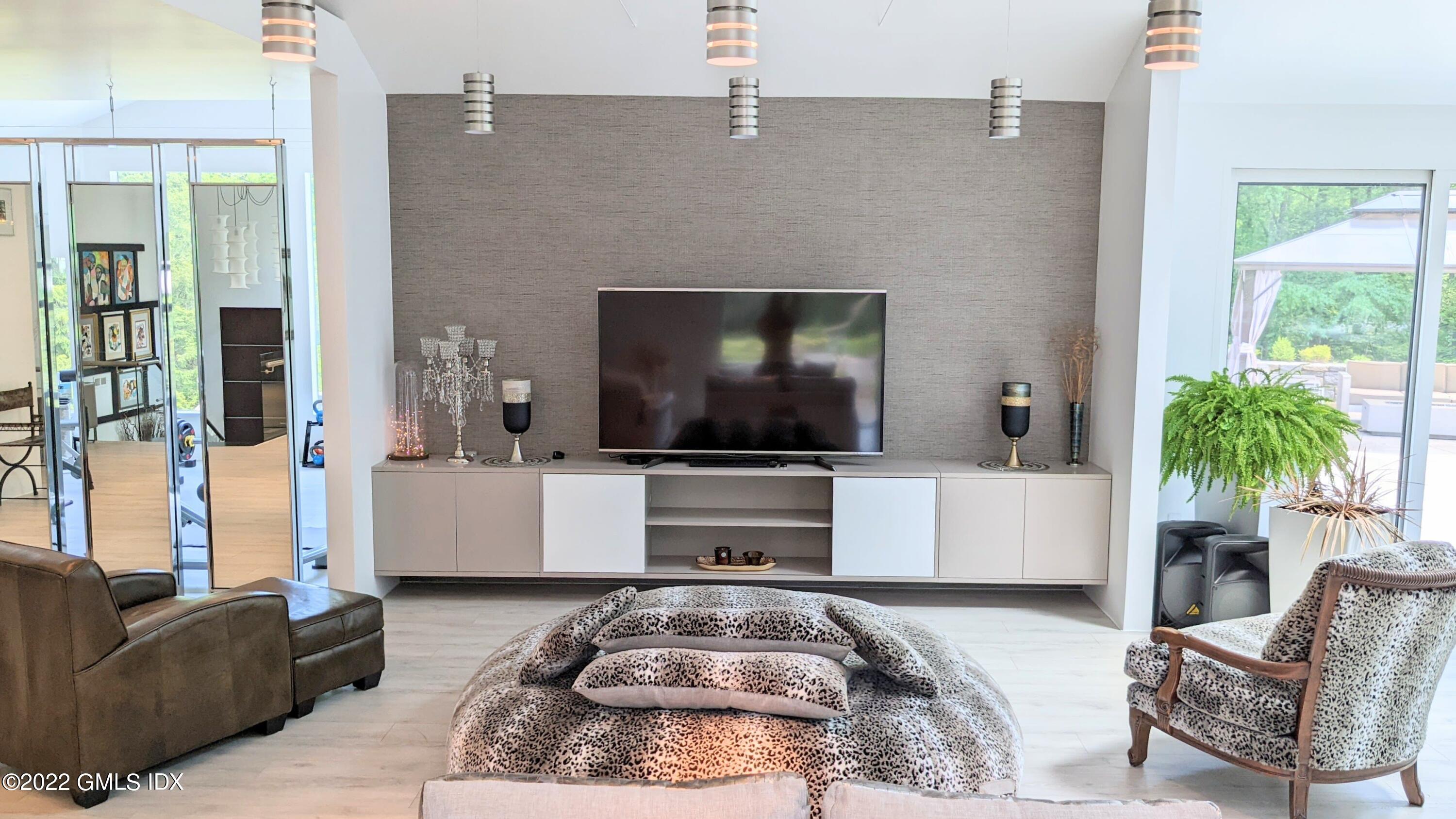 39 Nutmeg Drive Greenwich, CT 06831 - Photo 12 of 31 a living room with furniture and a flat screen tv