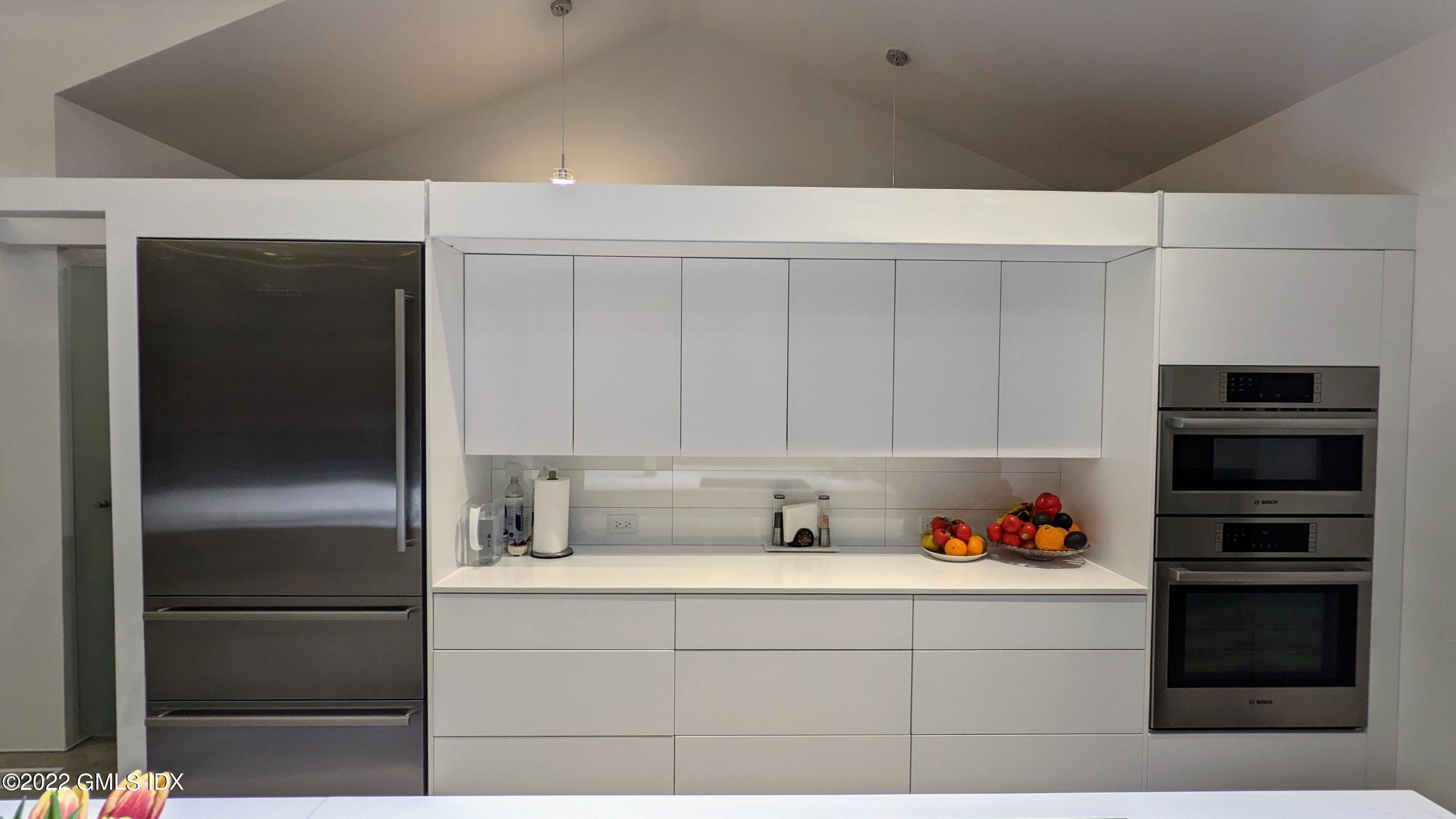 39 Nutmeg Drive Greenwich, CT 06831 - Photo 15 of 31 a kitchen with stainless steel appliances a refrigerator and cabinets