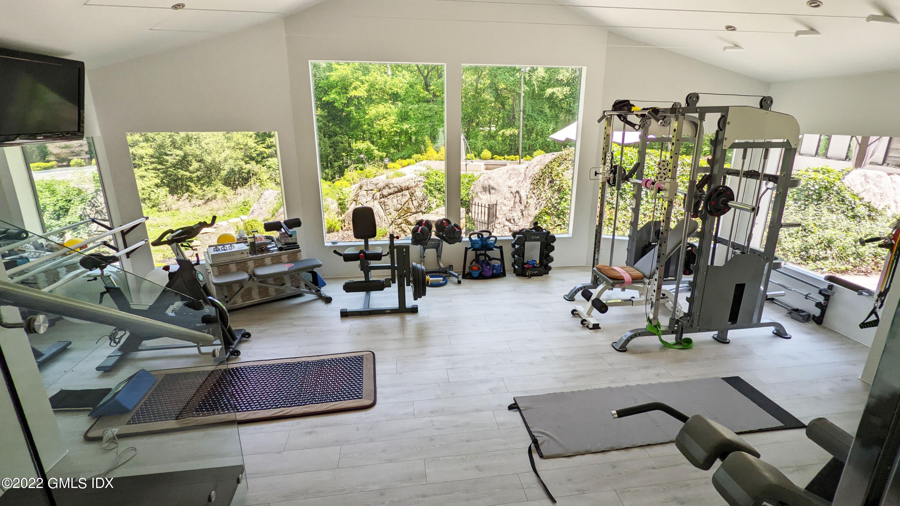 39 Nutmeg Drive Greenwich, CT 06831 - Photo 22 of 31 a view of a room with gym equipment