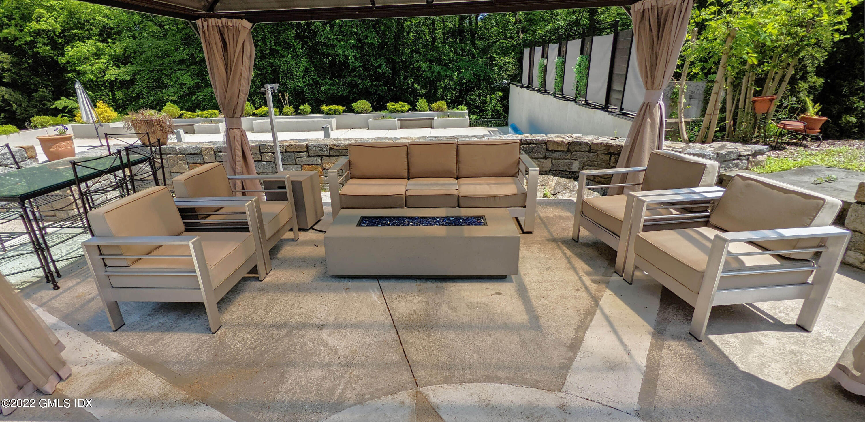 39 Nutmeg Drive Greenwich, CT 06831 - Photo 28 of 31 a view of an outdoor sitting area with a couch