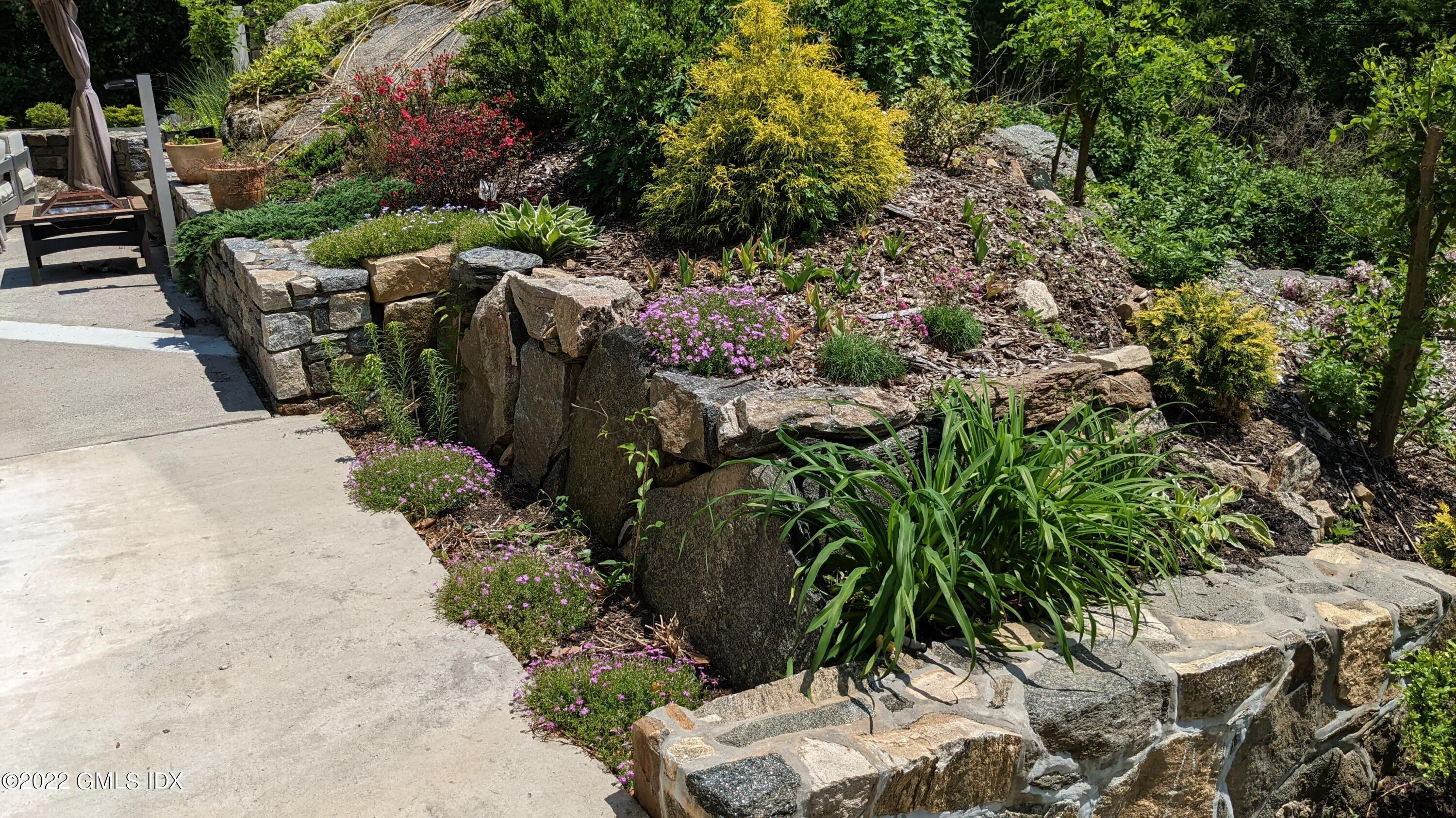39 Nutmeg Drive Greenwich, CT 06831 - Photo 31 of 31 a view of backyard with outdoor seating and green space