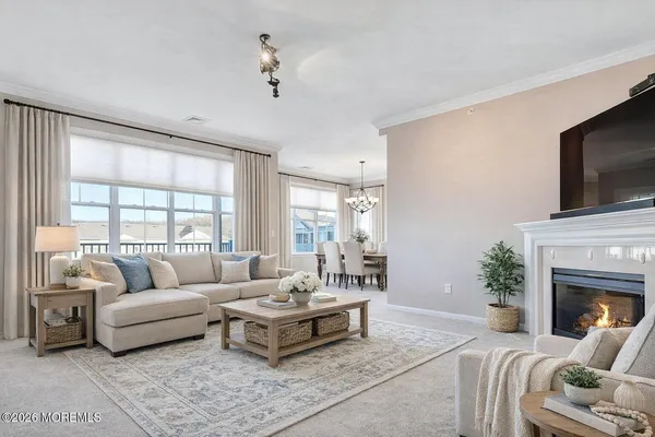 a living room with furniture fireplace and a flat screen tv