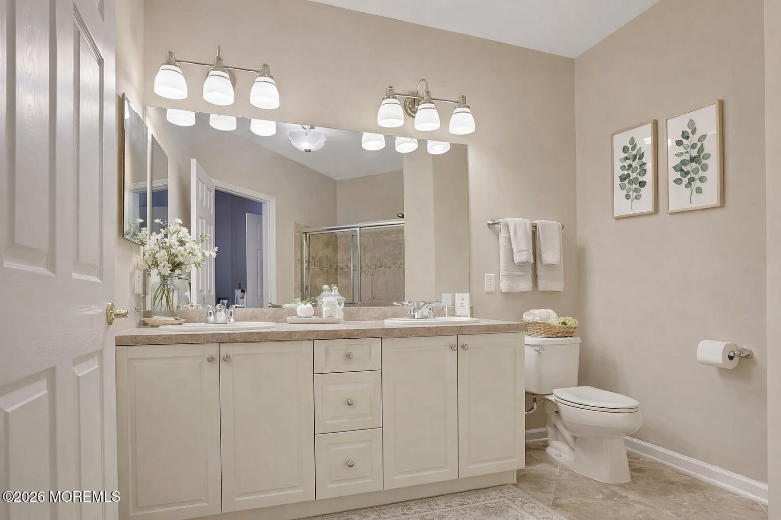 631 Sloan Court Matawan, NJ 07747 - Photo 6 of 10 a bathroom with a toilet sink and mirror