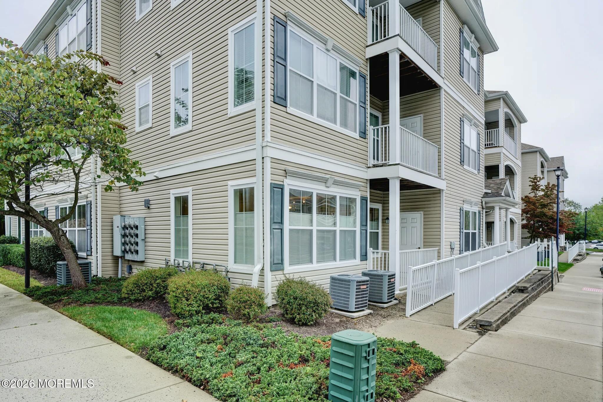 631 Sloan Court Matawan, NJ 07747 - Photo 8 of 10 a front view of a house with a yard outdoor seating and pathway