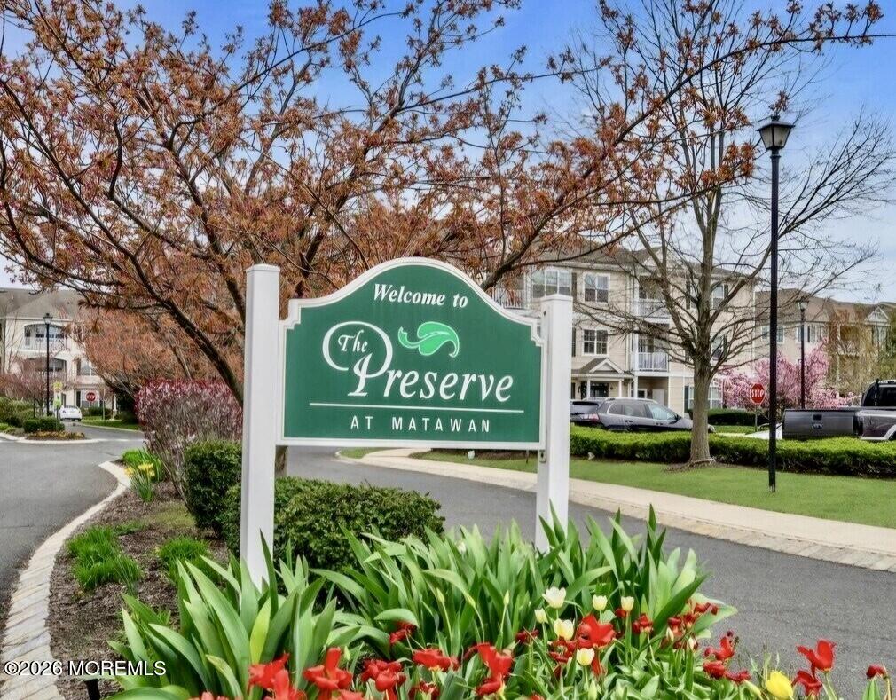 631 Sloan Court Matawan, NJ 07747 - Photo 10 of 10 a sign that is sitting in front of flowers