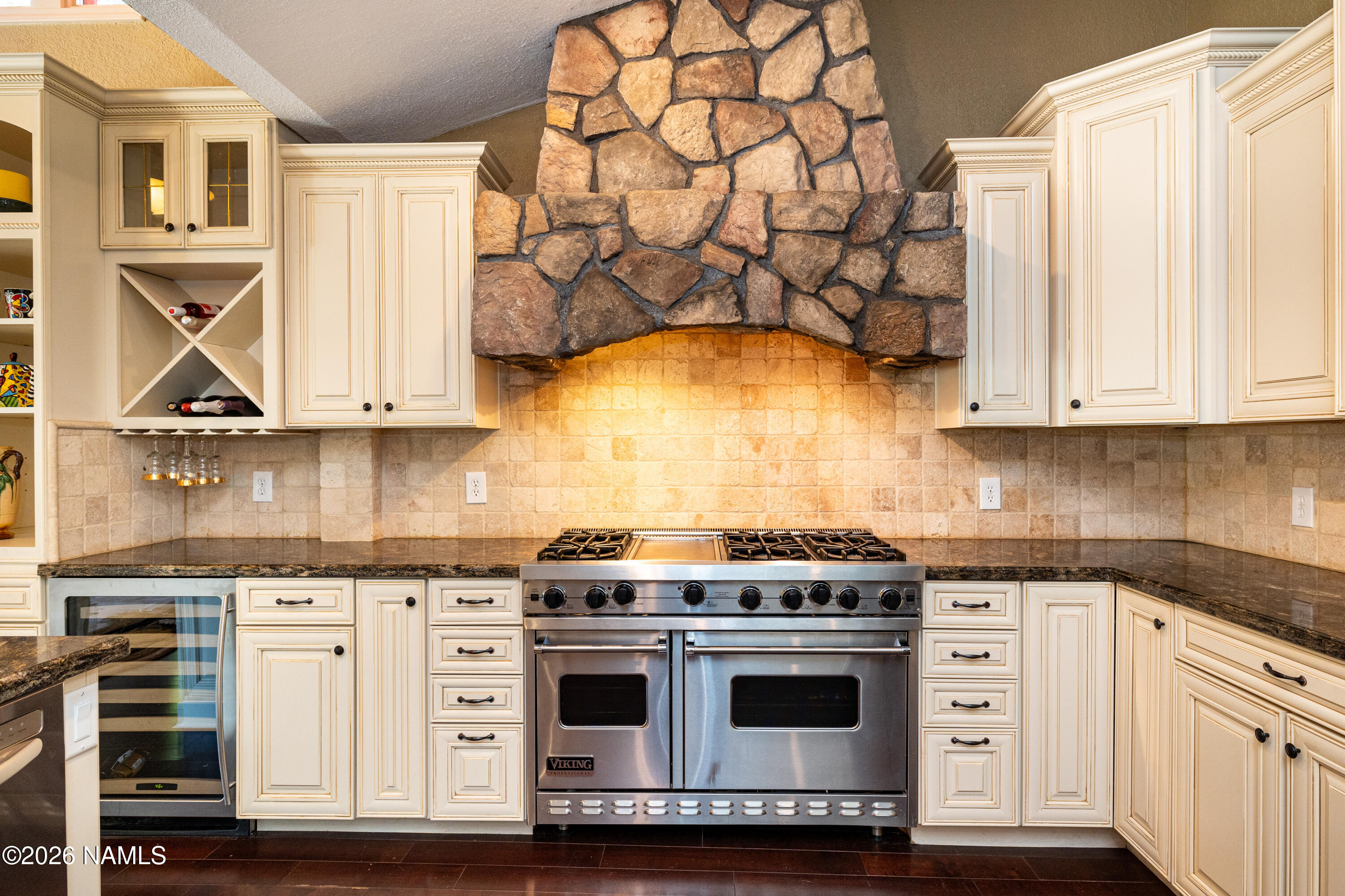 1407 North Mariposa Road Flagstaff, AZ 86004 - Photo 18 of 85 a kitchen with stainless steel appliances granite countertop a stove and a white cabinets