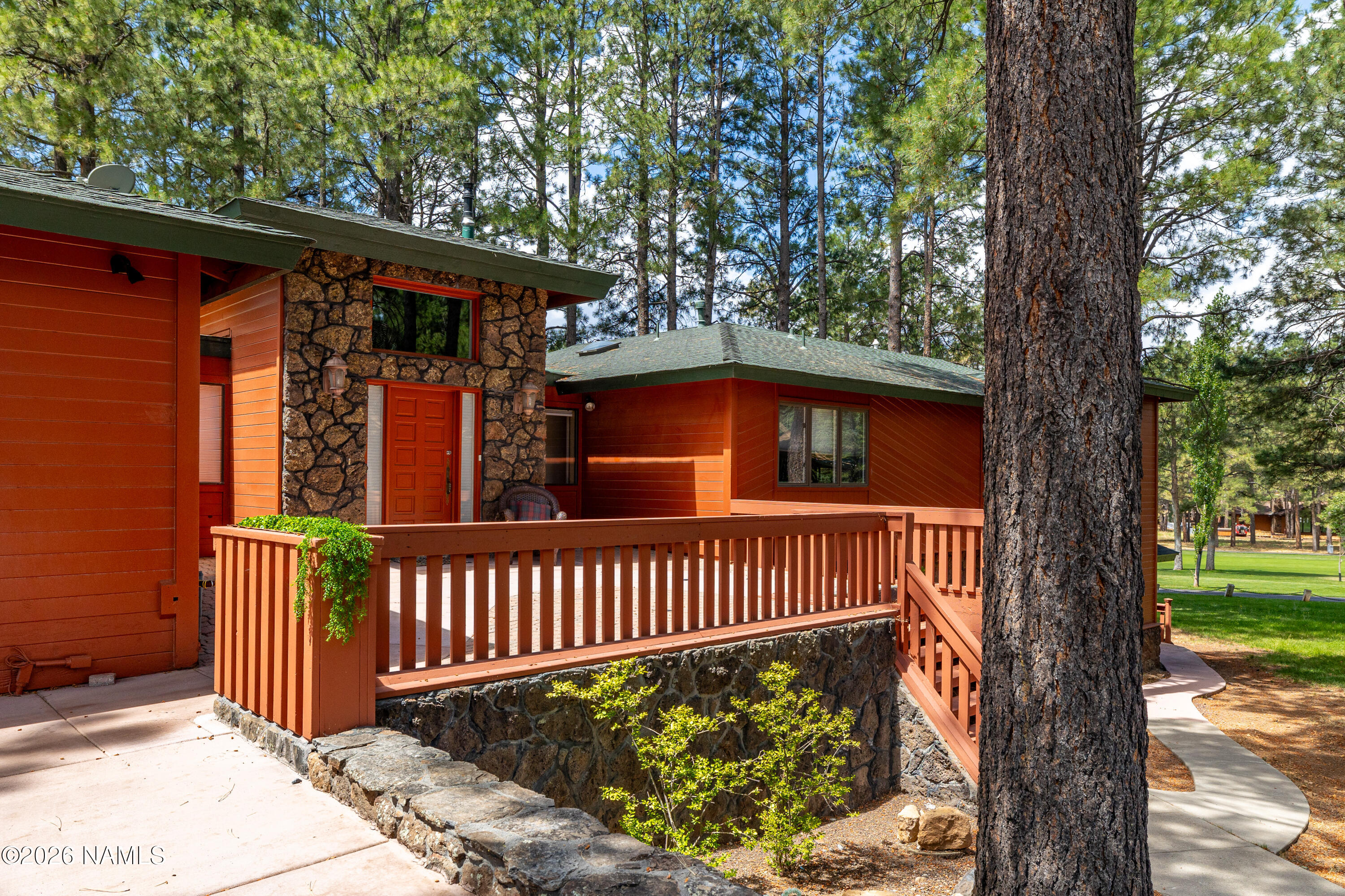 1407 North Mariposa Road Flagstaff, AZ 86004 - Photo 2 of 85 a view of a deck with a fence