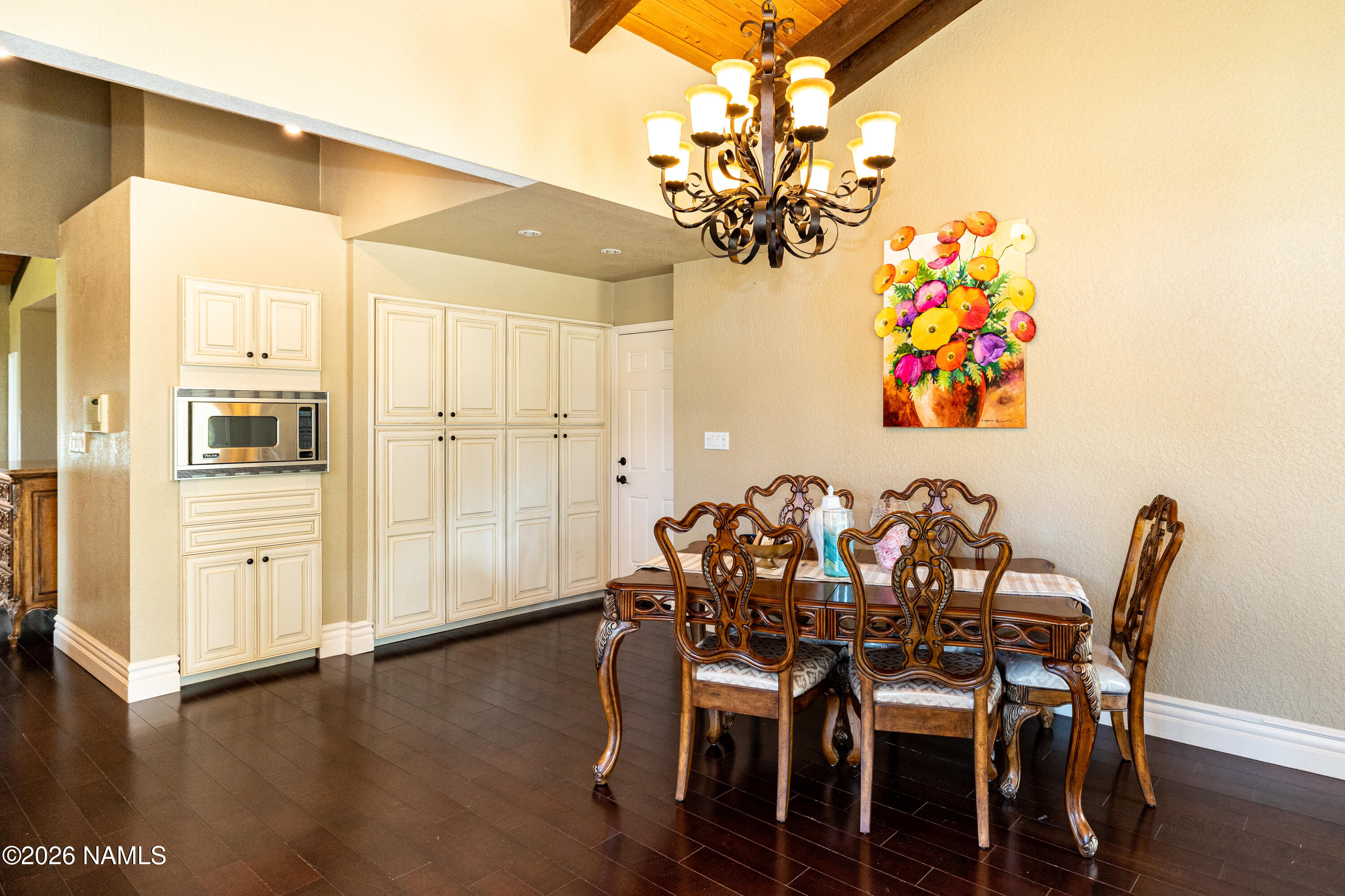 1407 North Mariposa Road Flagstaff, AZ 86004 - Photo 26 of 85 a view of a dining room with furniture and wooden floor