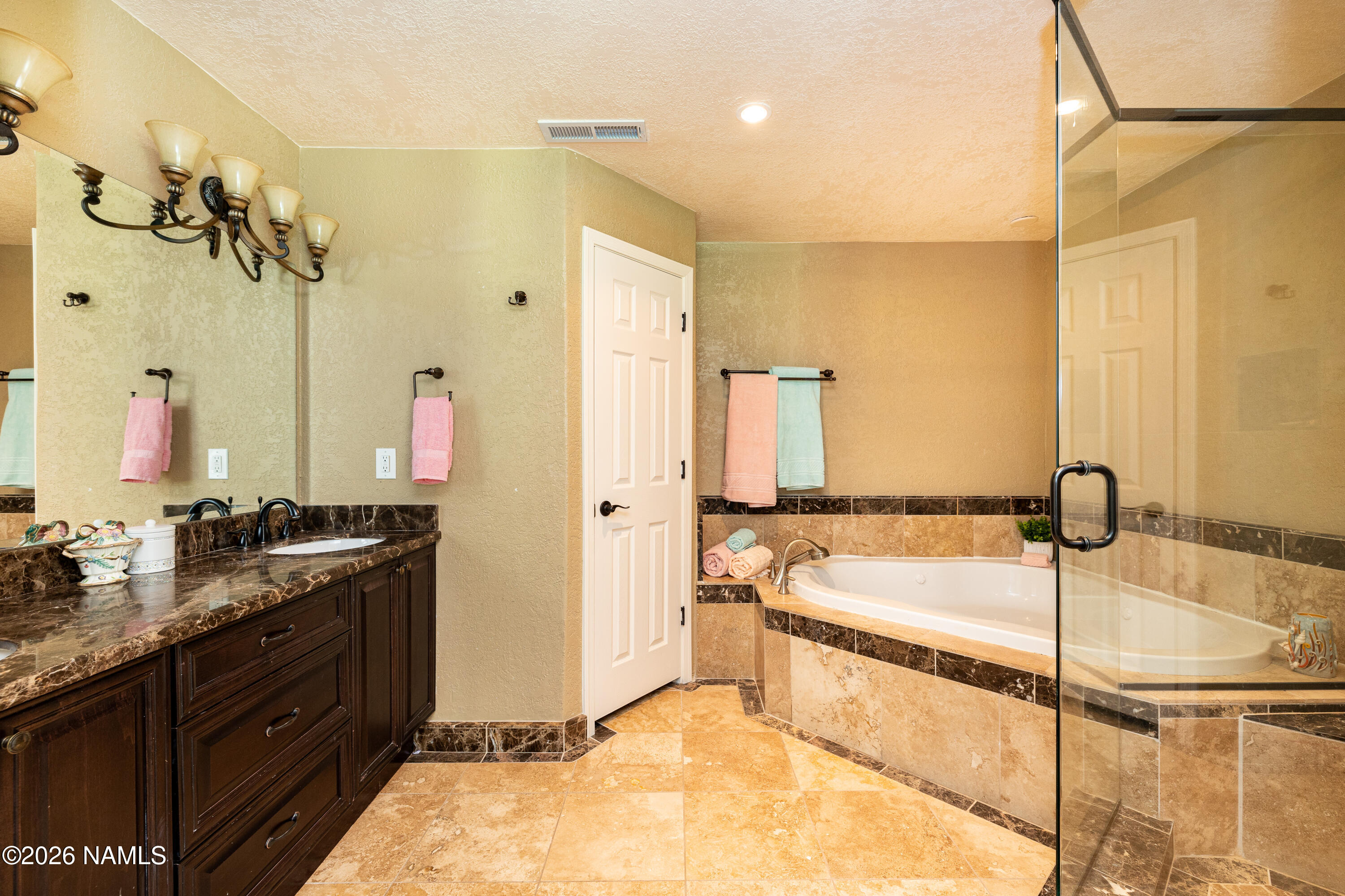 1407 North Mariposa Road Flagstaff, AZ 86004 - Photo 33 of 85 a bathroom with a tub sink and mirror