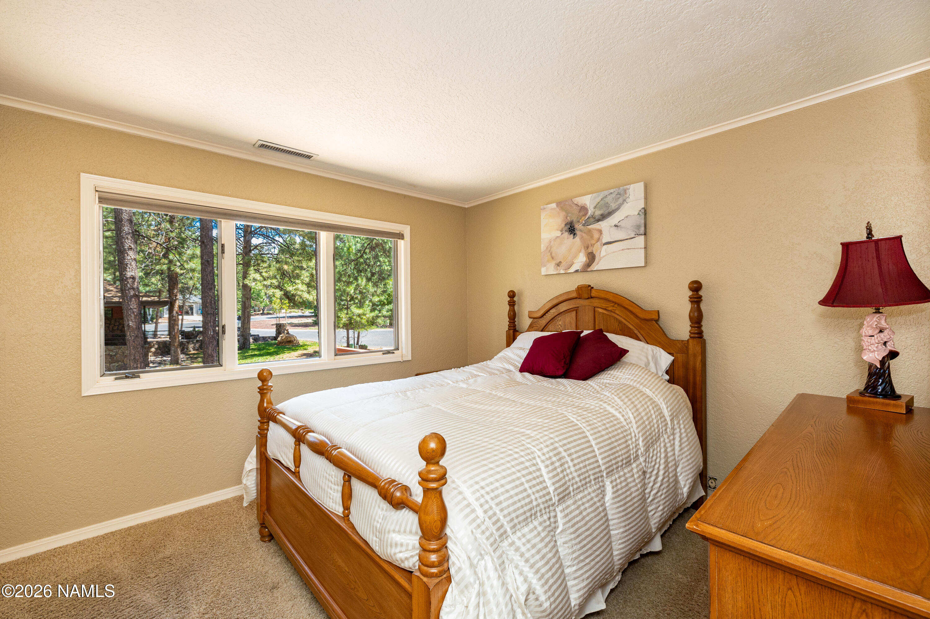 1407 North Mariposa Road Flagstaff, AZ 86004 - Photo 38 of 85 a bedroom with a bed and a window