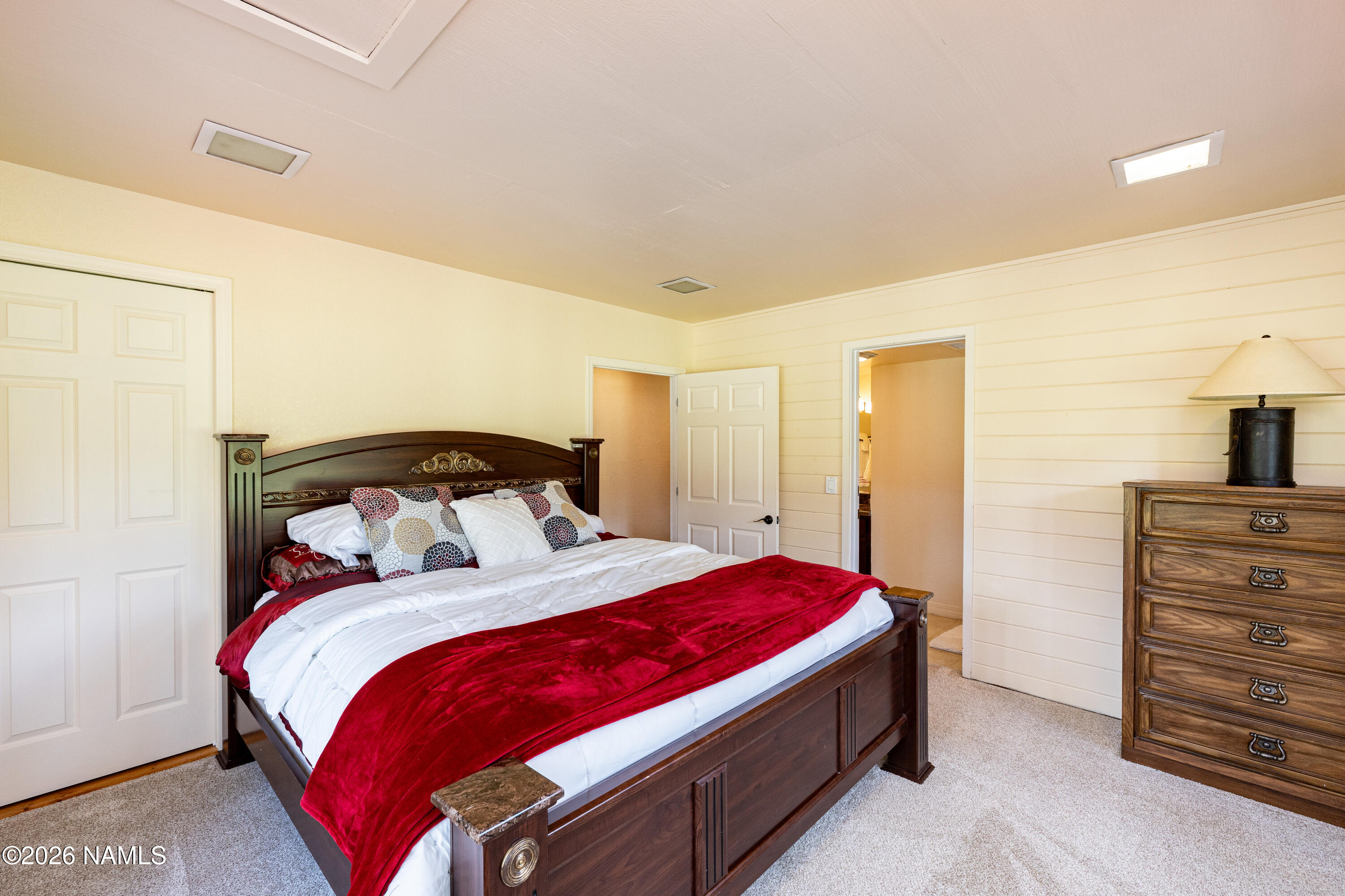 1407 North Mariposa Road Flagstaff, AZ 86004 - Photo 41 of 85 a bedroom with a bed and a dresser