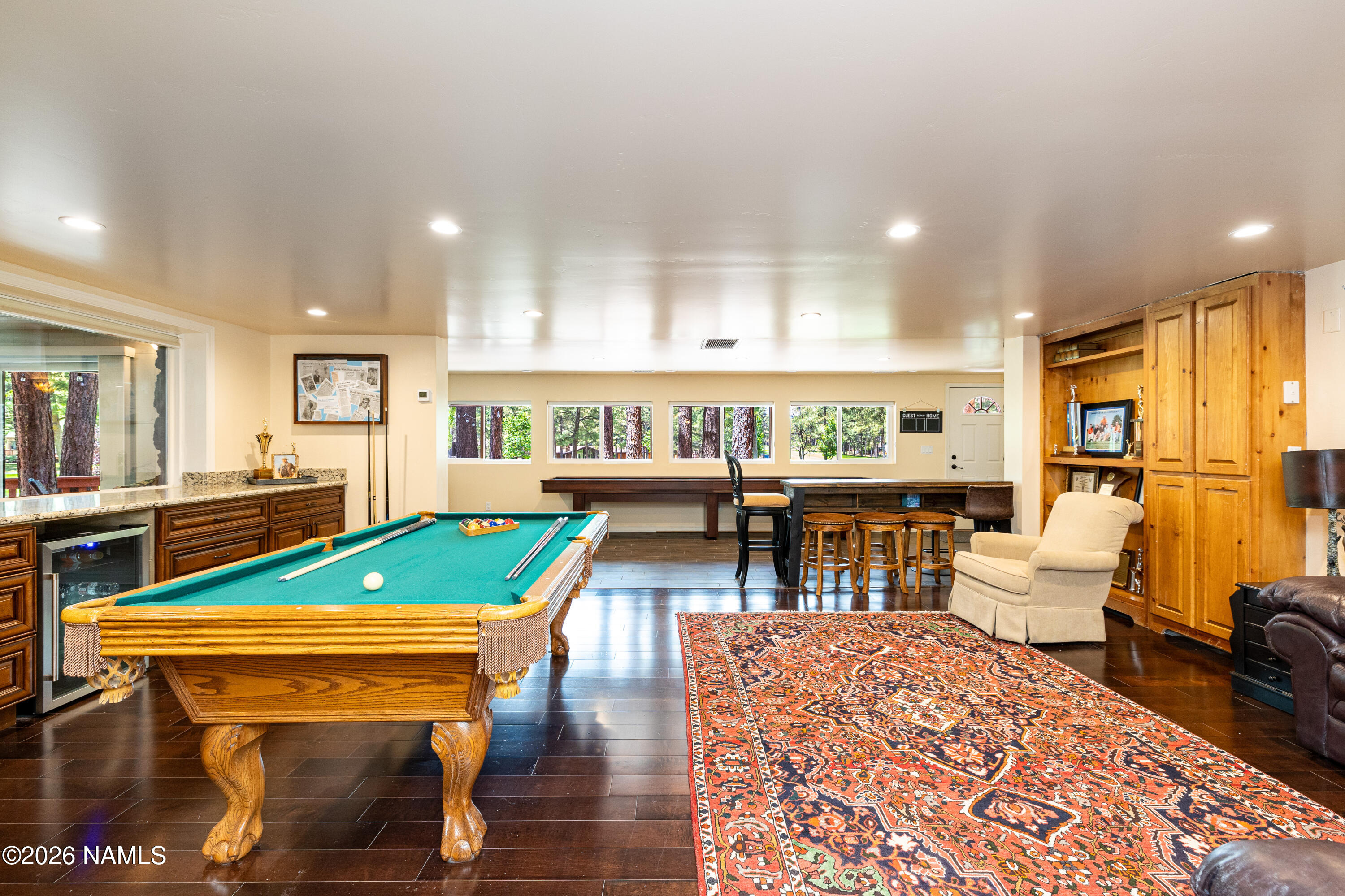 1407 North Mariposa Road Flagstaff, AZ 86004 - Photo 52 of 85 a living room with furniture a pool table and a large window