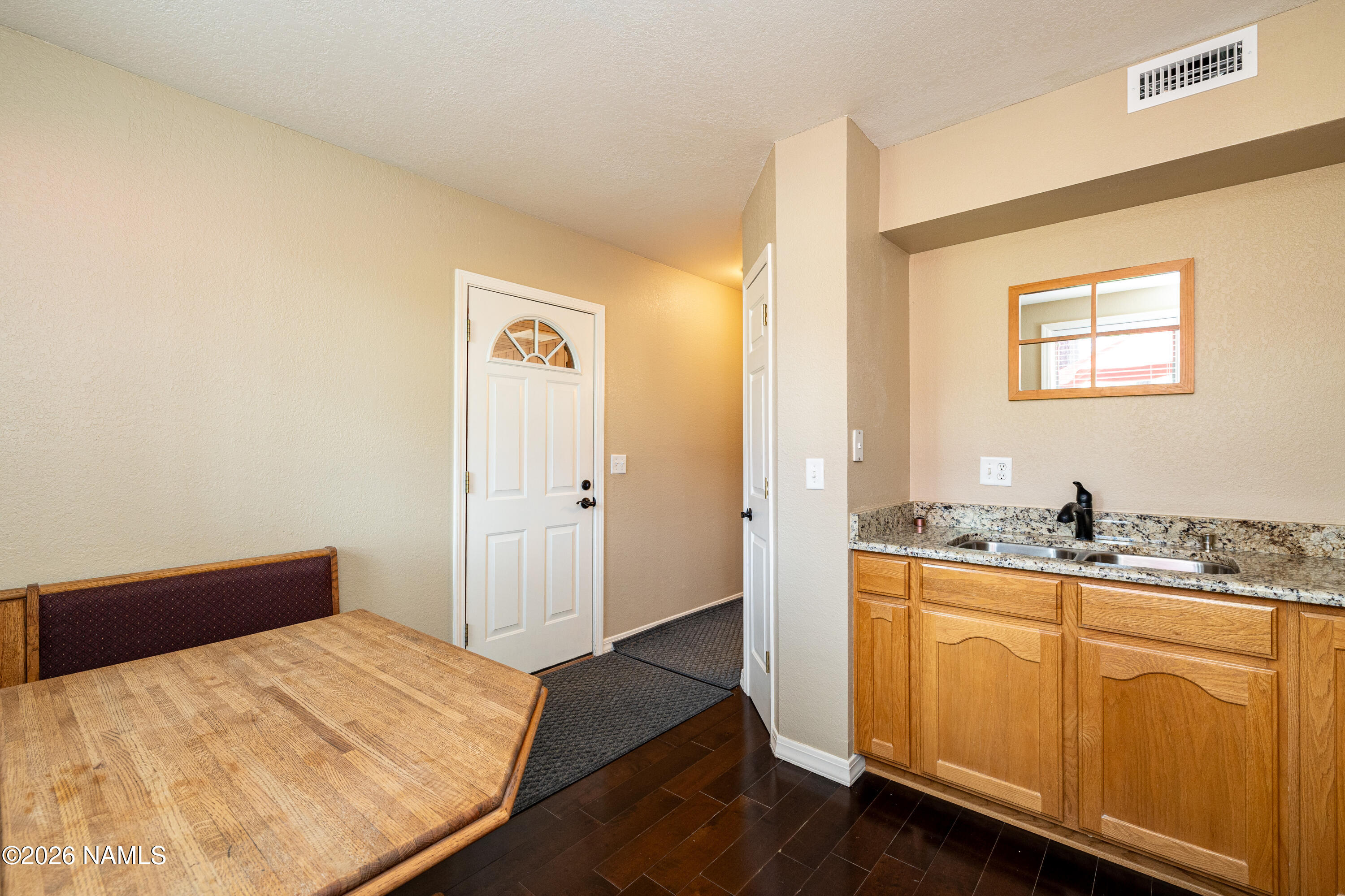 1407 North Mariposa Road Flagstaff, AZ 86004 - Photo 58 of 85 a bedroom with a bed and cabinet