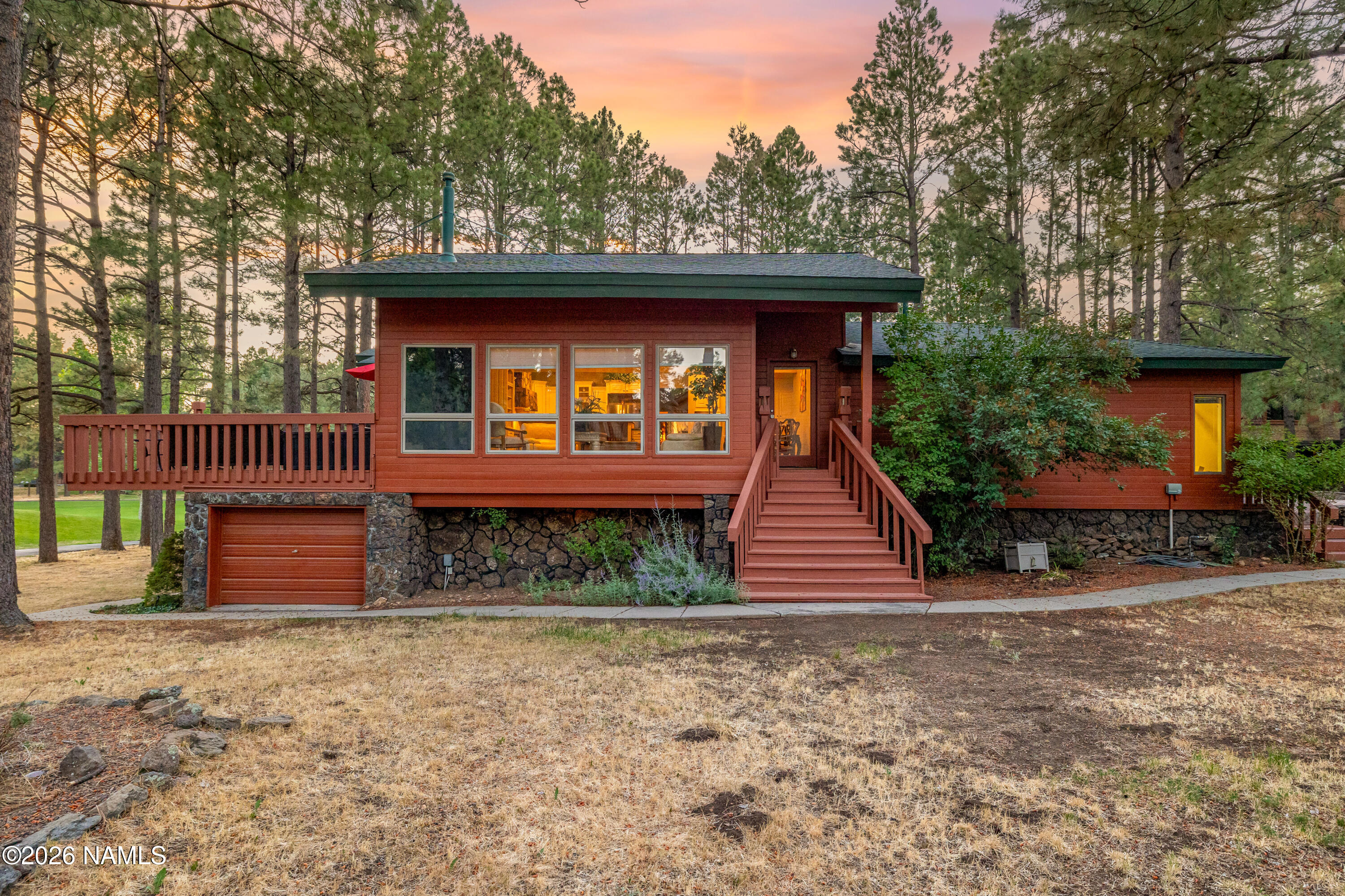 1407 North Mariposa Road Flagstaff, AZ 86004 - Photo 72 of 85 a front view of a house with a yard