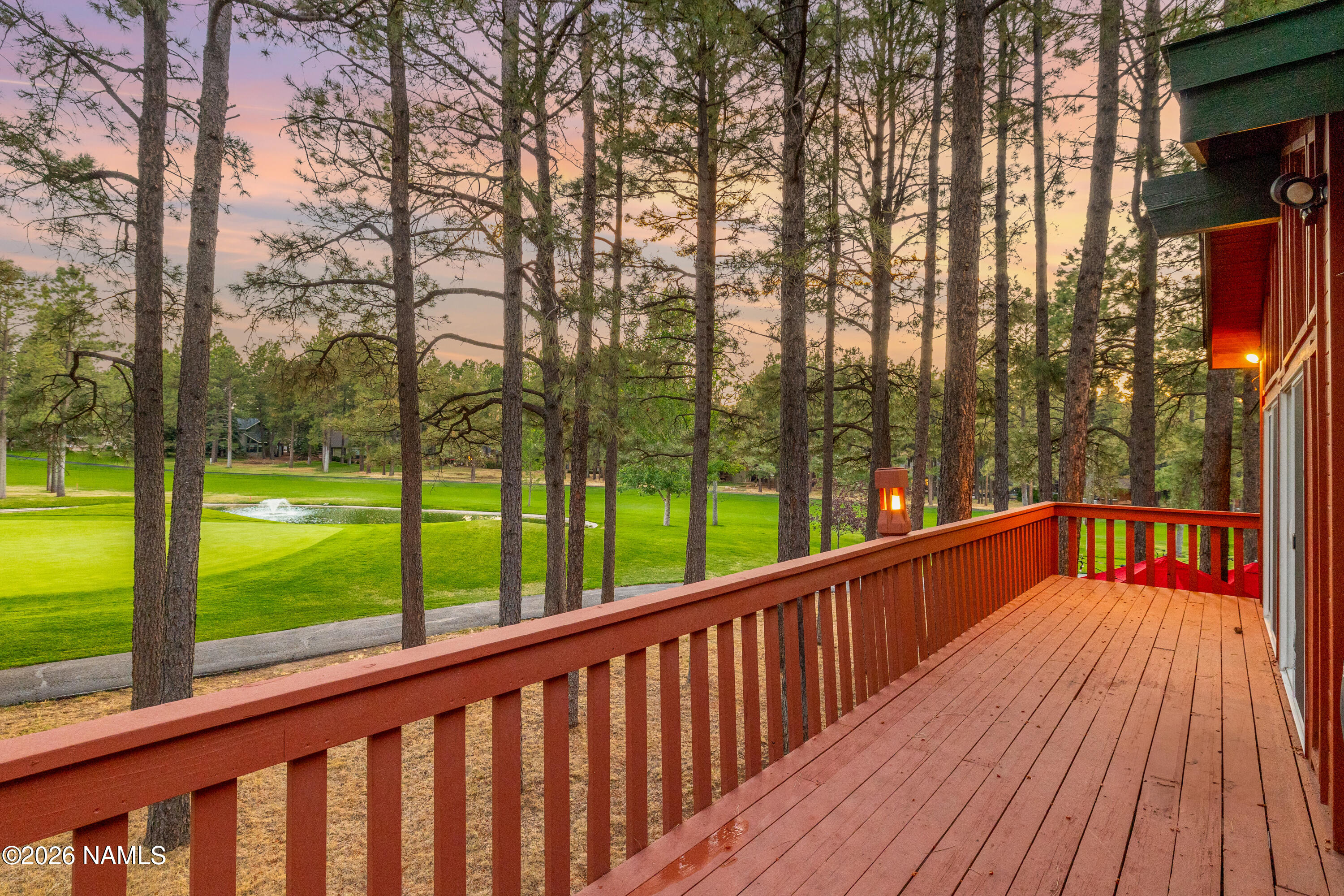 1407 North Mariposa Road Flagstaff, AZ 86004 - Photo 73 of 85 a view of balcony with deck and trees