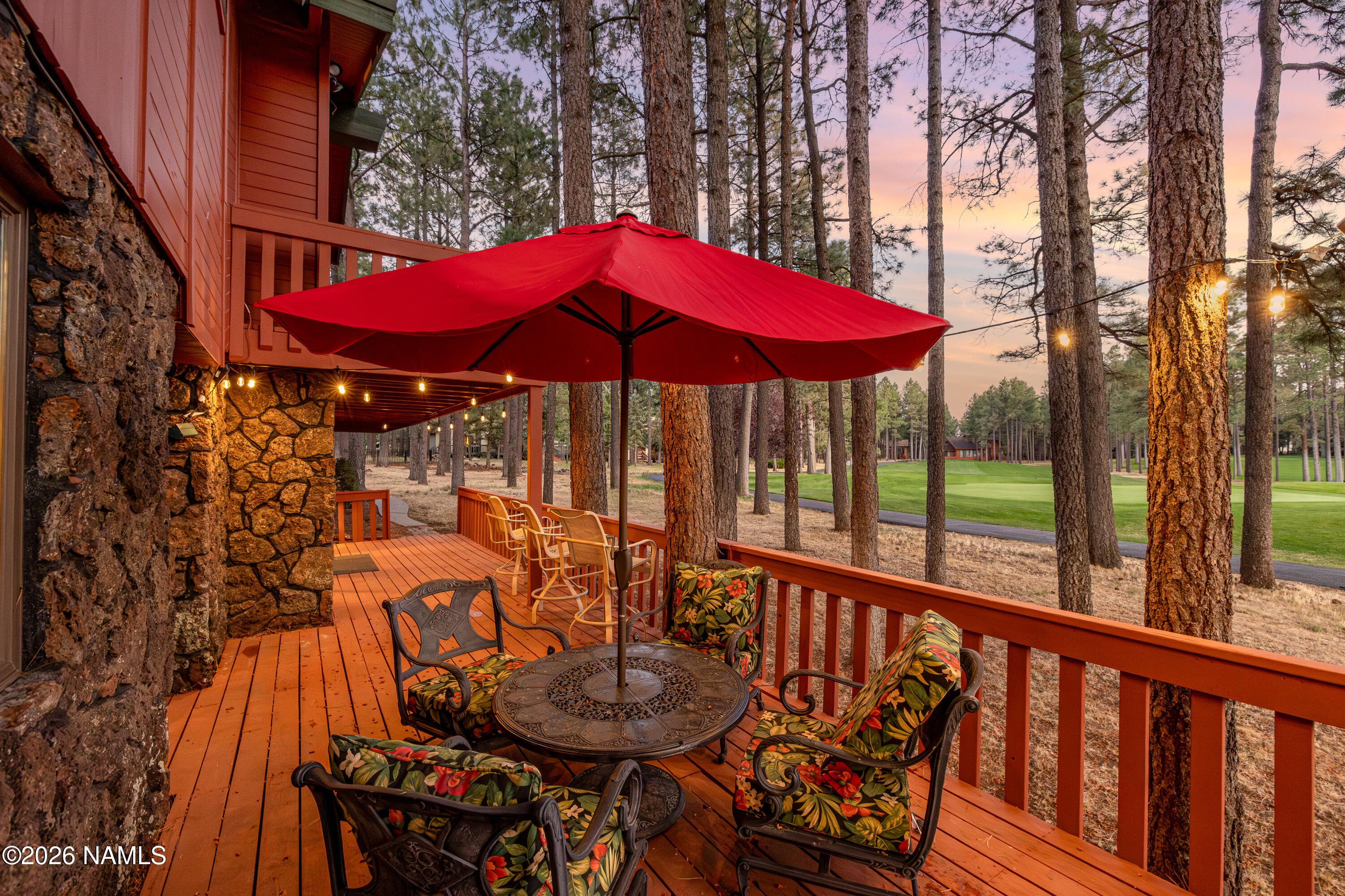 1407 North Mariposa Road Flagstaff, AZ 86004 - Photo 74 of 85 a view of balcony with outdoor seating and wooden floor