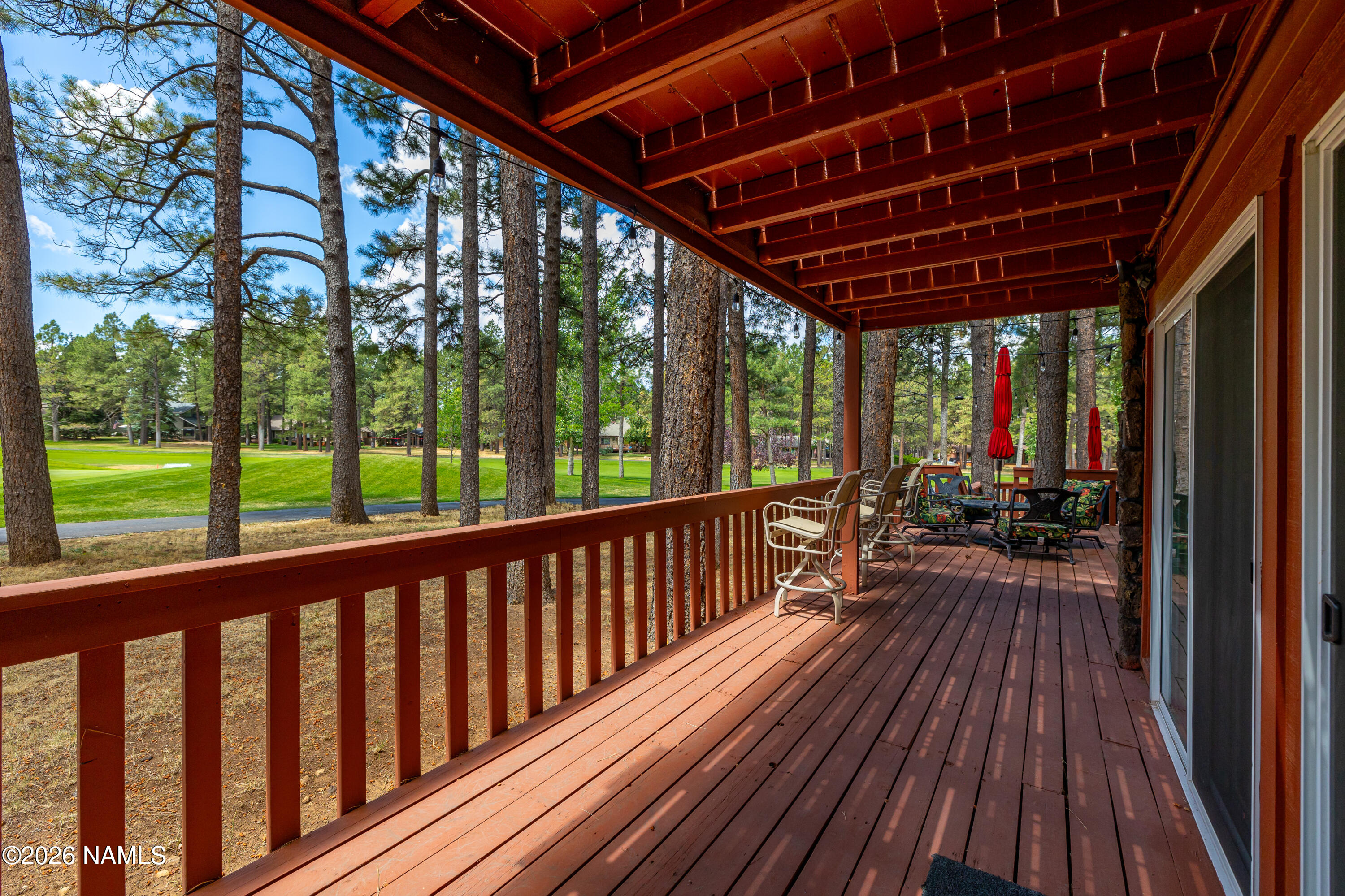 1407 North Mariposa Road Flagstaff, AZ 86004 - Photo 79 of 85 a view of porch with wooden floor in outdoor space