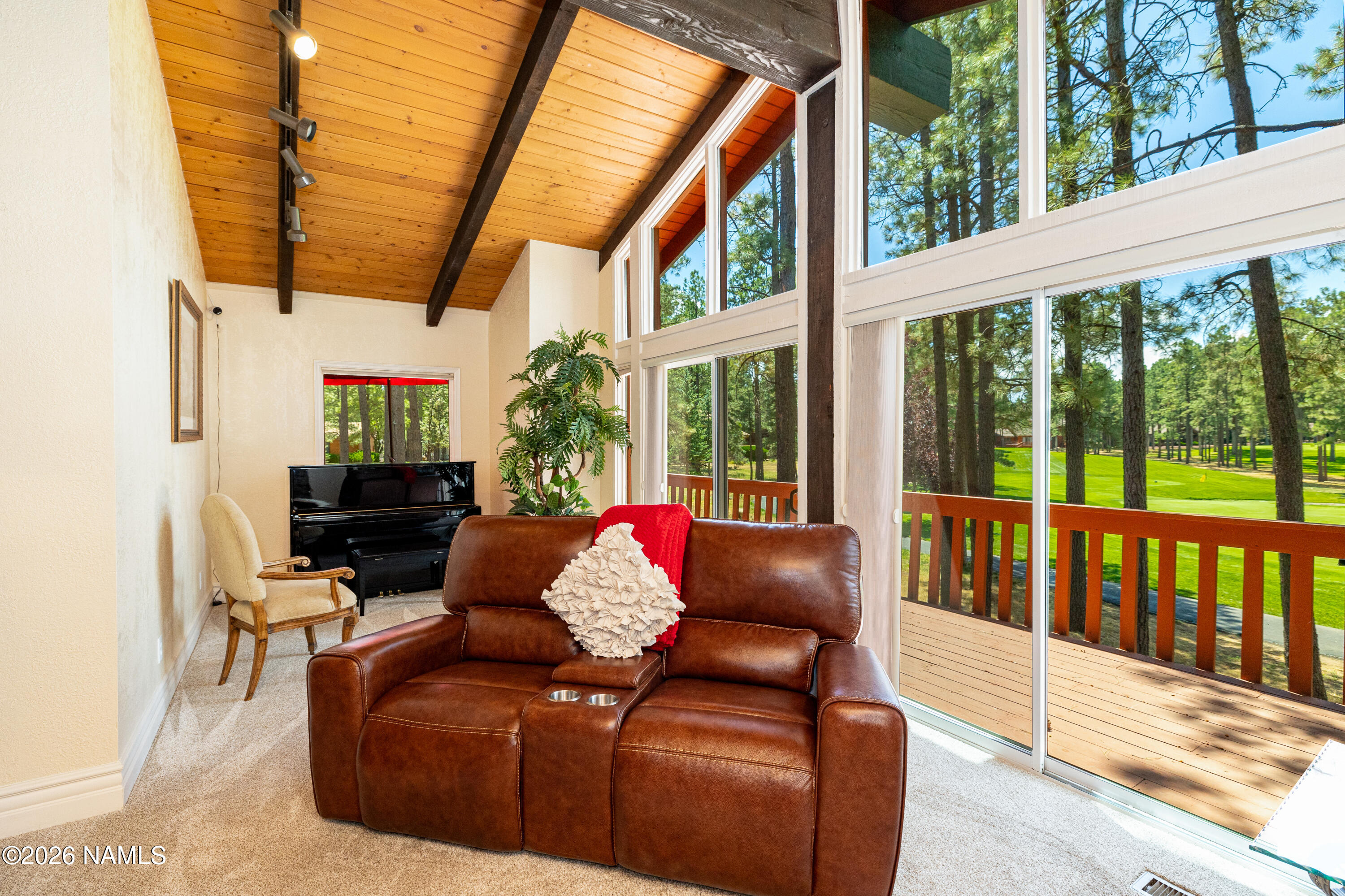 1407 North Mariposa Road Flagstaff, AZ 86004 - Photo 10 of 85 a outdoor living room with furniture and a floor to ceiling window