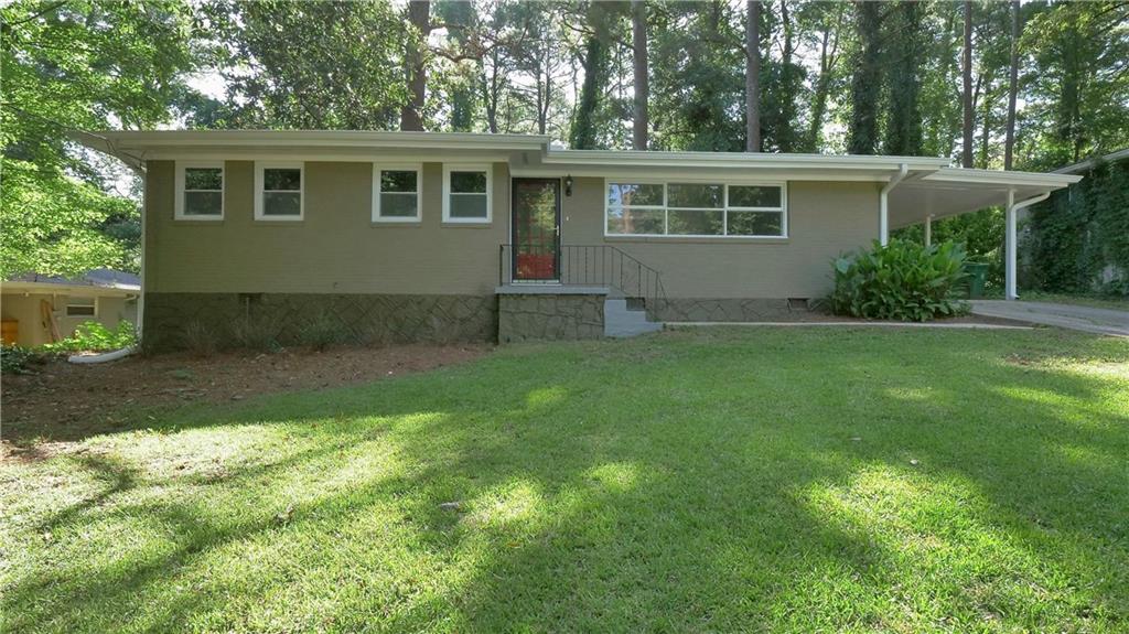1374 Margarette Drive Decatur, GA 30035 - Photo 1 of 1 a backyard of a house with seating space